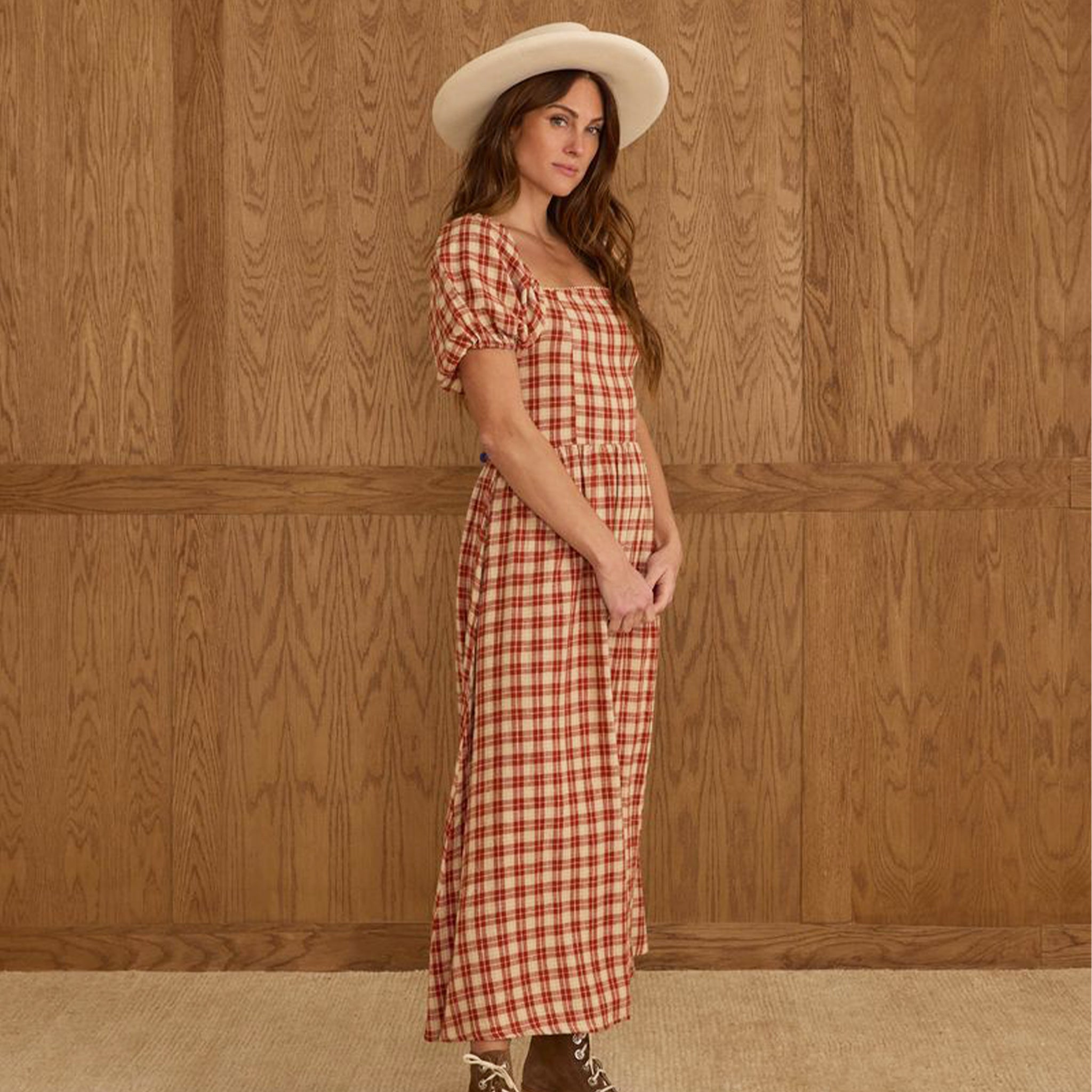 A red and ivory plaid dress with puff sleeves and a square neckline. 