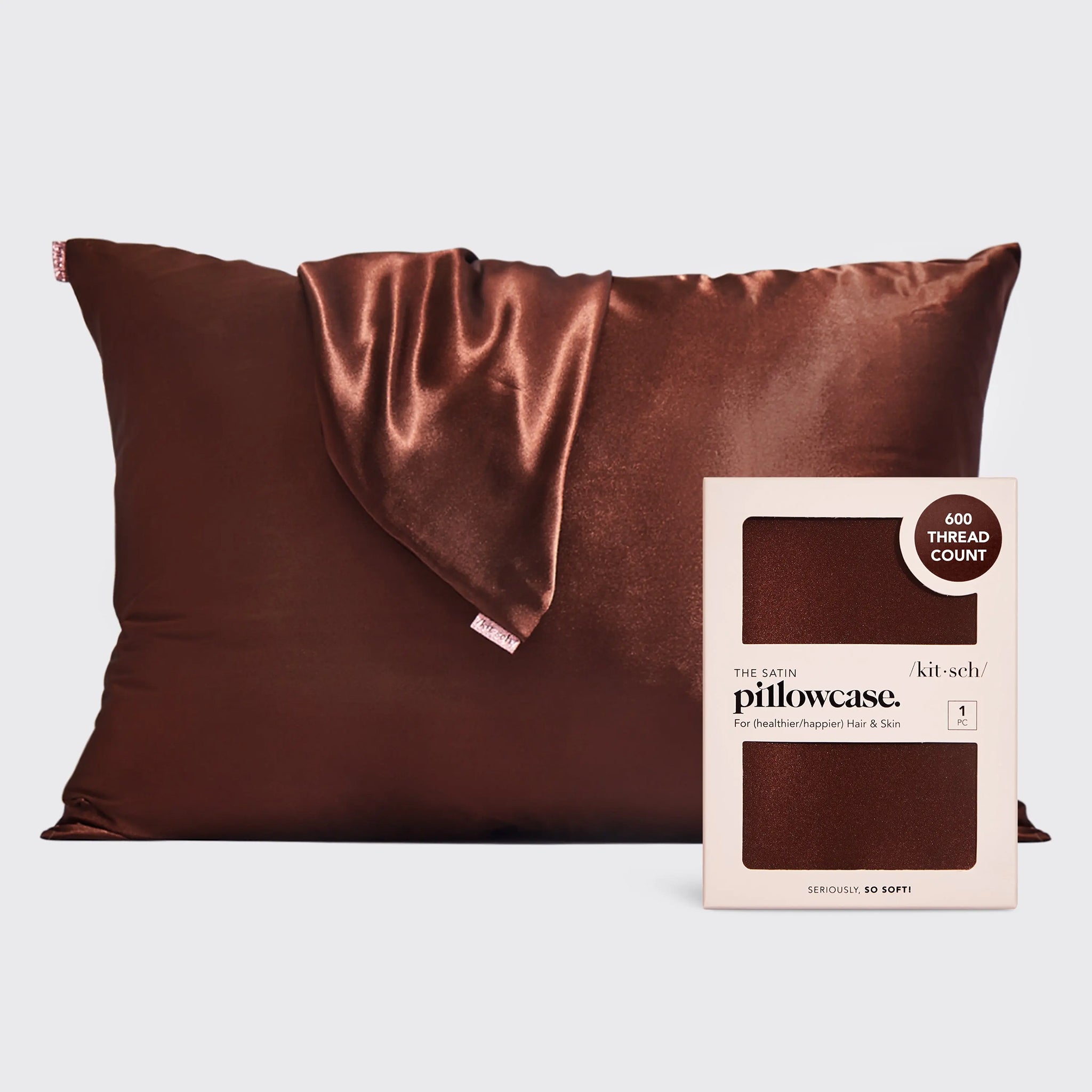 A chocolate brown satin pillow case. 
