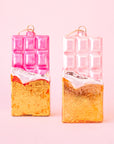 A pink and gold glass shaped chocolate bar with the loop for hanging. 