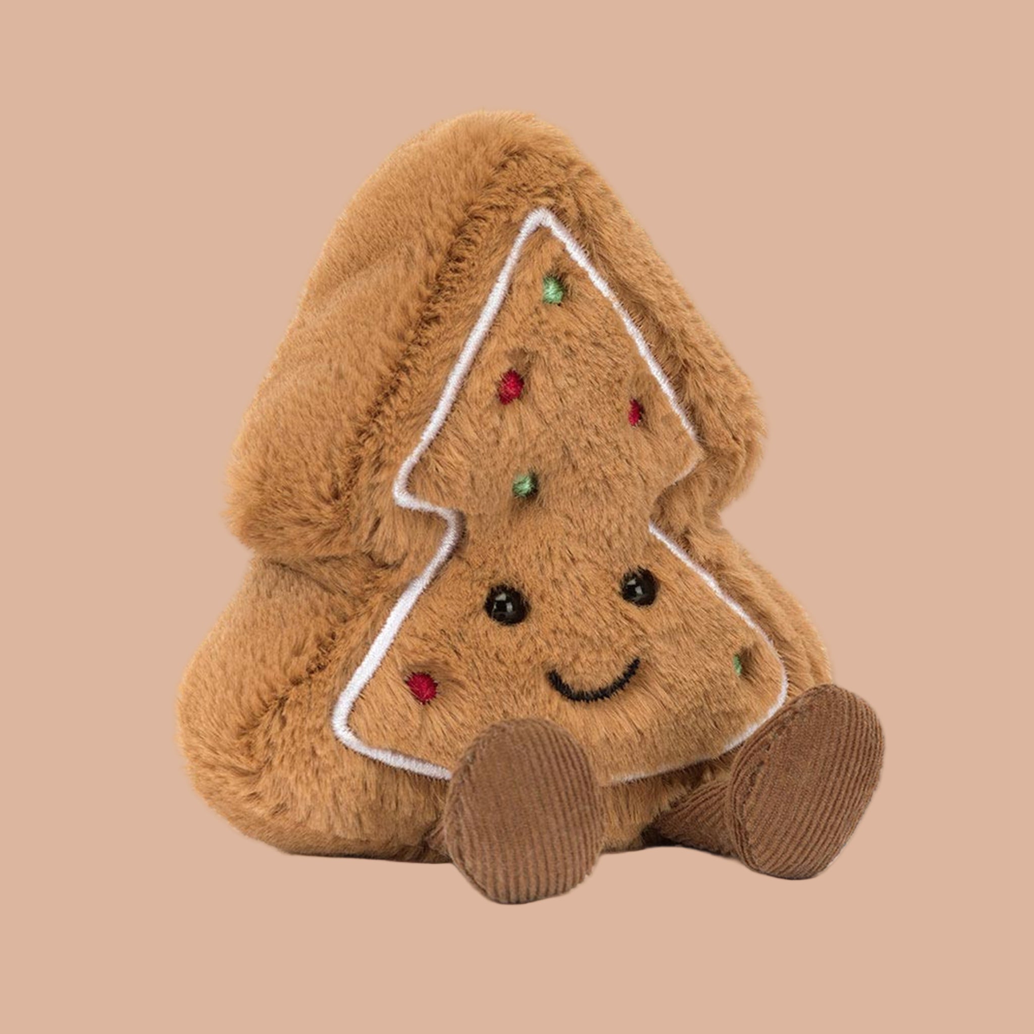 A brown tree cookie shaped stuffed toy with a smiling face and brown legs and feet. 