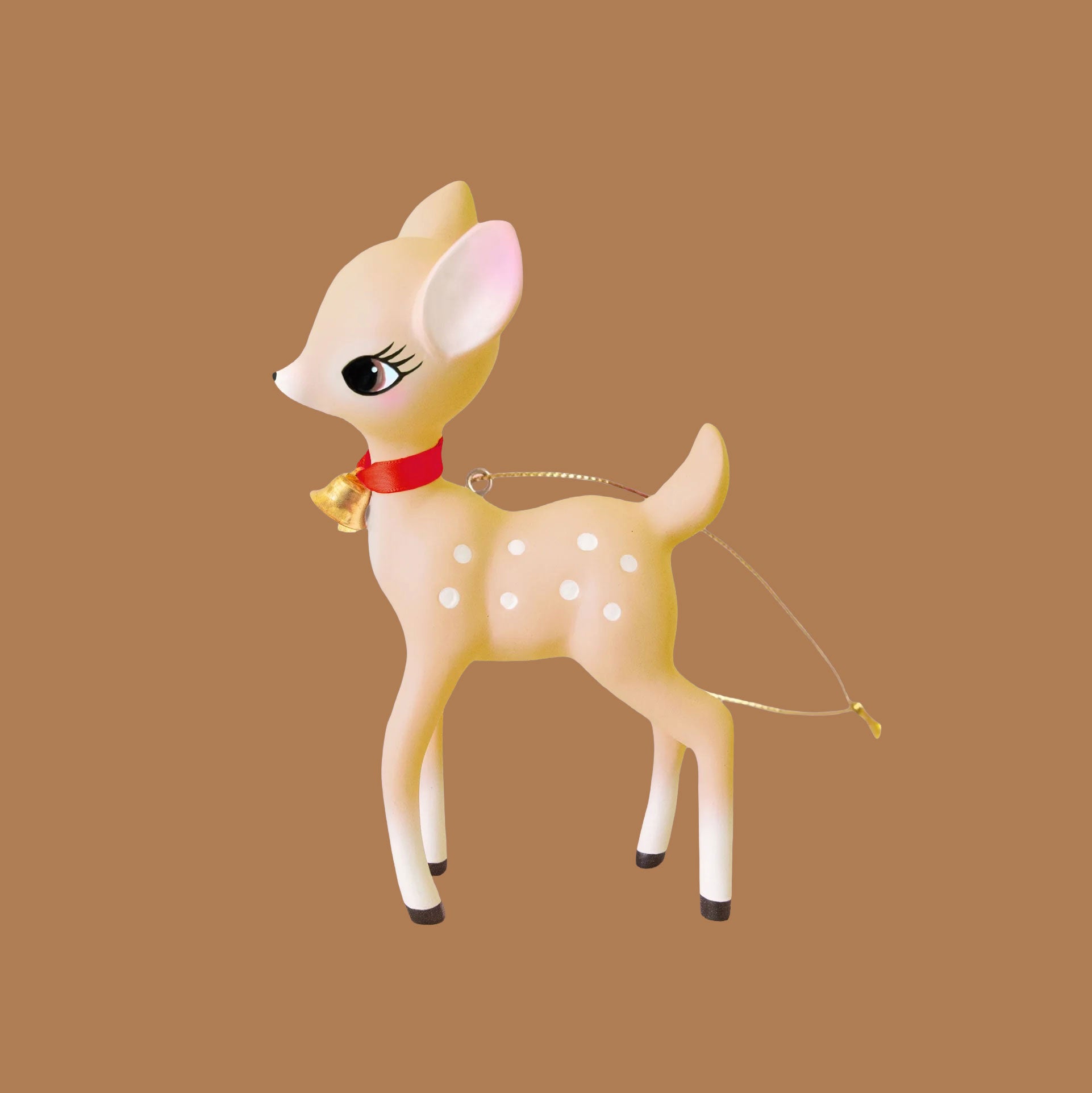 A tan retro deer ornament on a soft brown background.