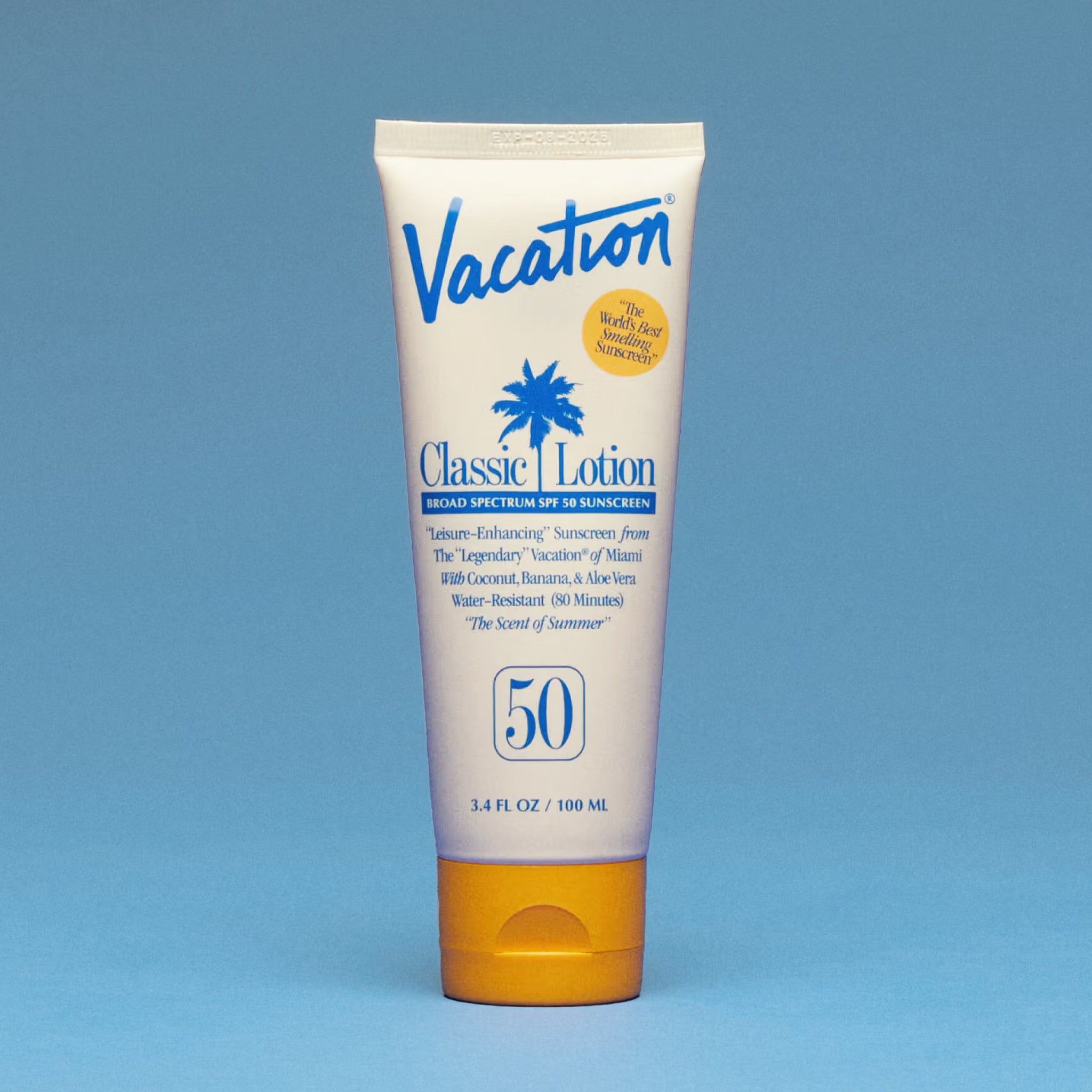 A bottle of SPF 50 with blue text and a yellow cap. 