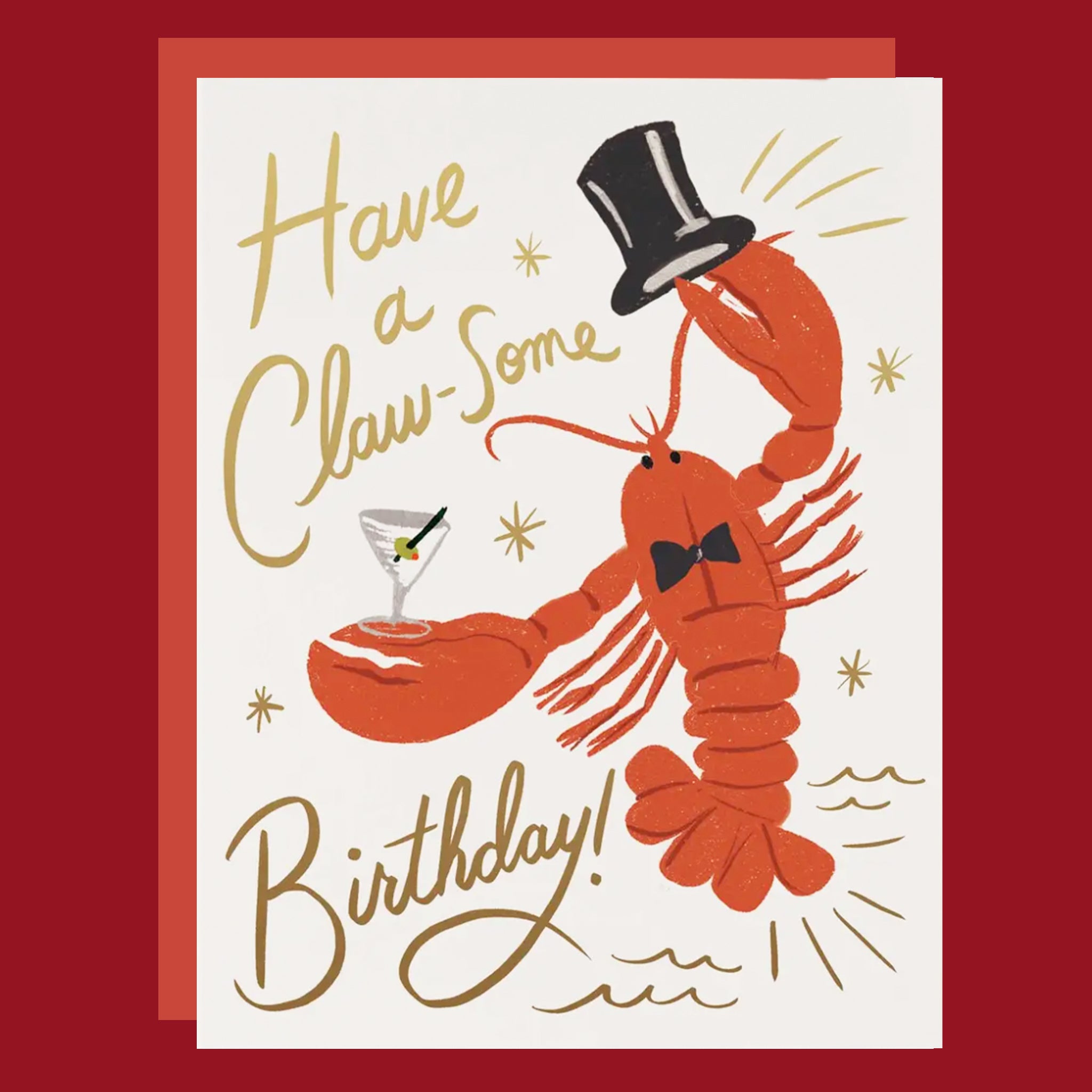 Birthday card with a lobster holding a martini glass and text 'Have a Claw-some Birthday!' on a red background.