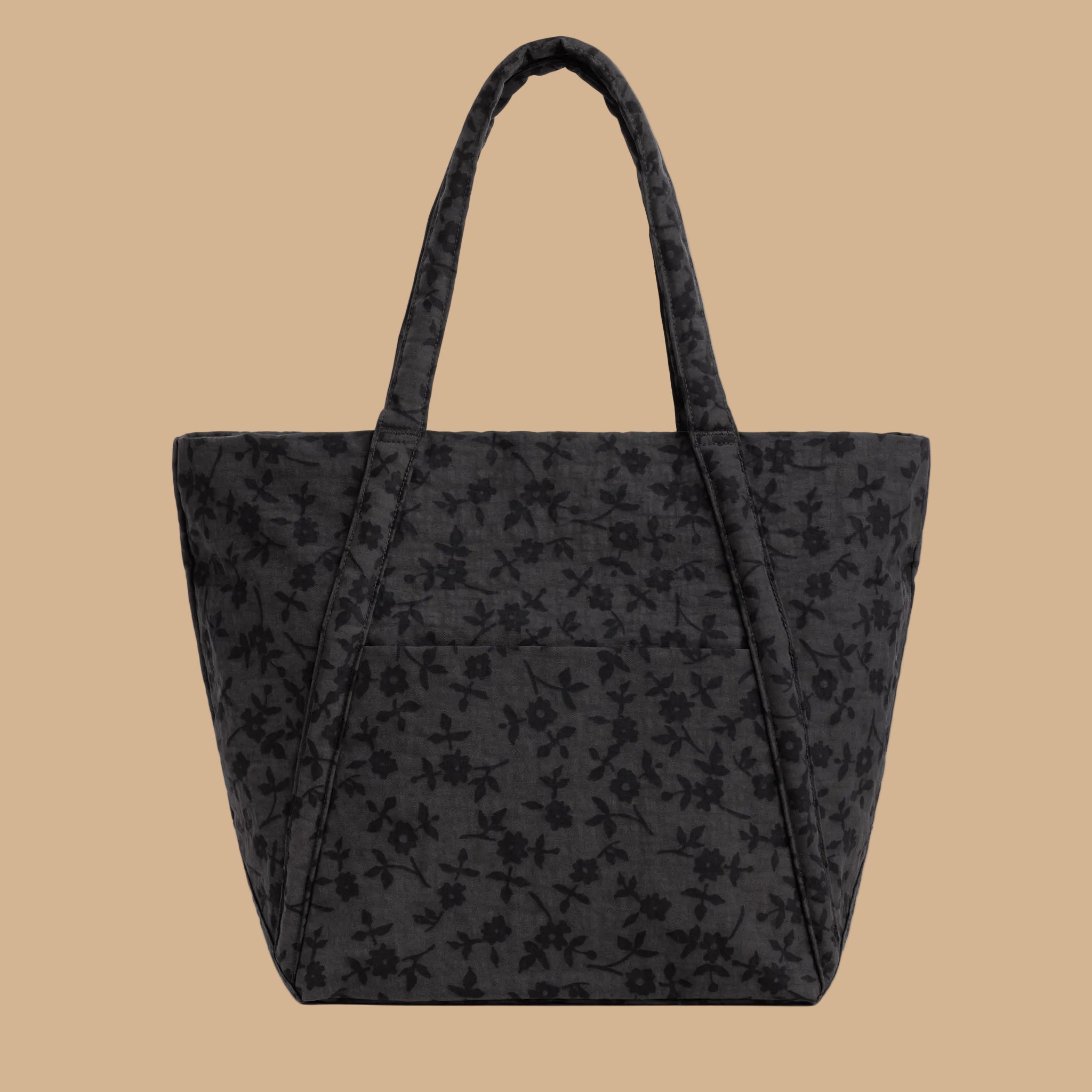 A black and grey tote bag with a floral pattern.