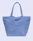 A blue nylon tote bag with two handle straps and a front pocket. 