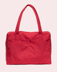A red nylon carry on tote bag with two handles and a zipper top. 