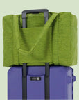 A vibrant green puffer tote bag. 
