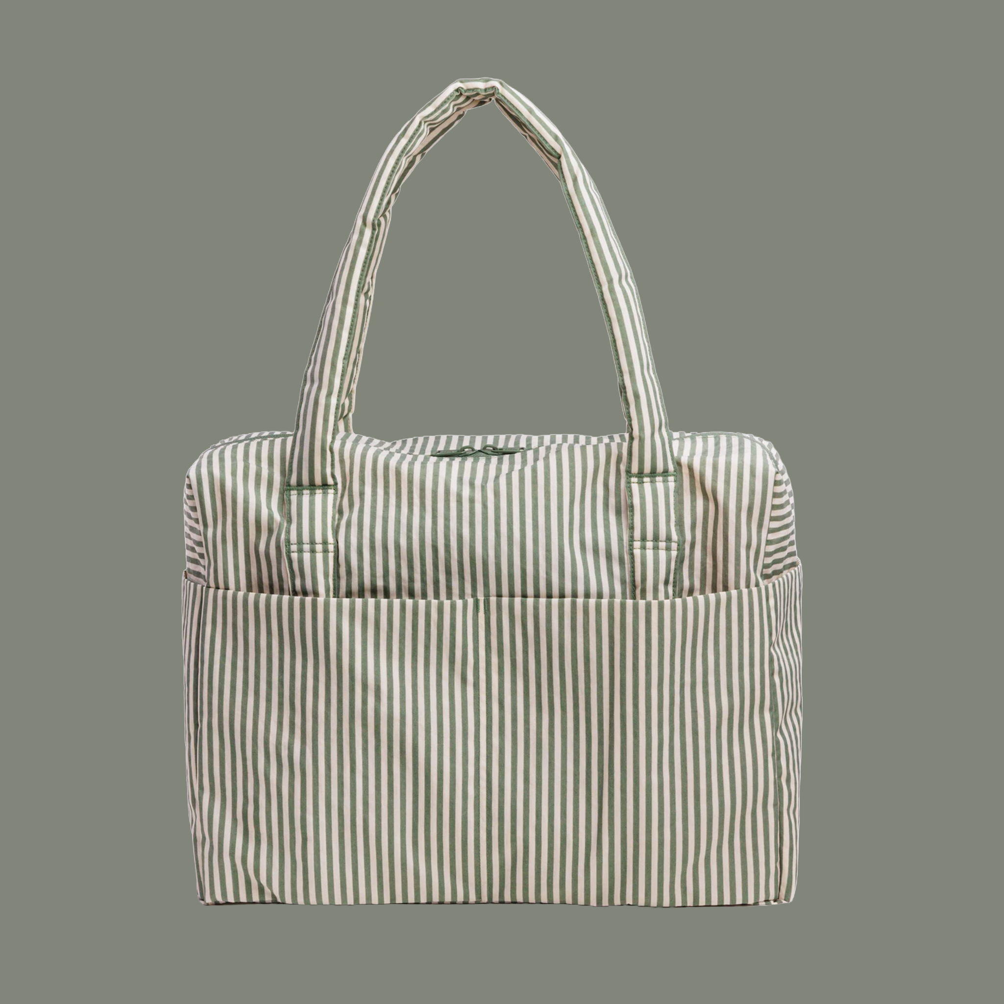 sage colored striped bag on a sage colored background.