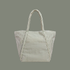sage colored striped bag with sage colored straps on a sage colored ground.