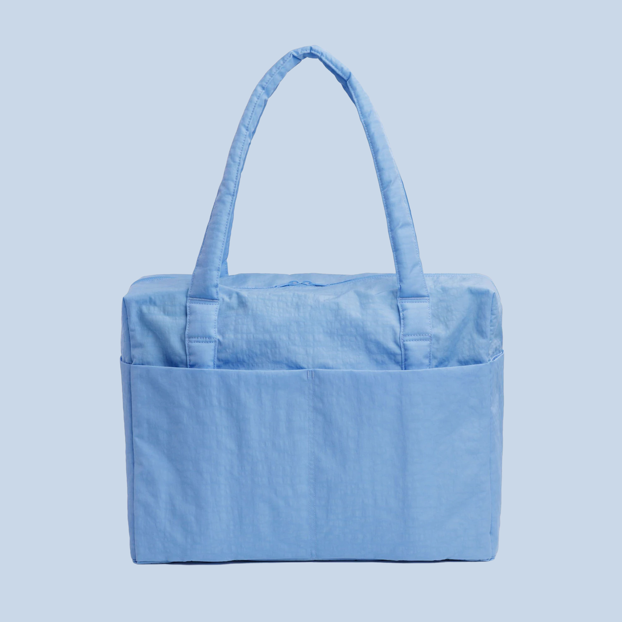 powder blue nylon shoulder bag on a blue ground.