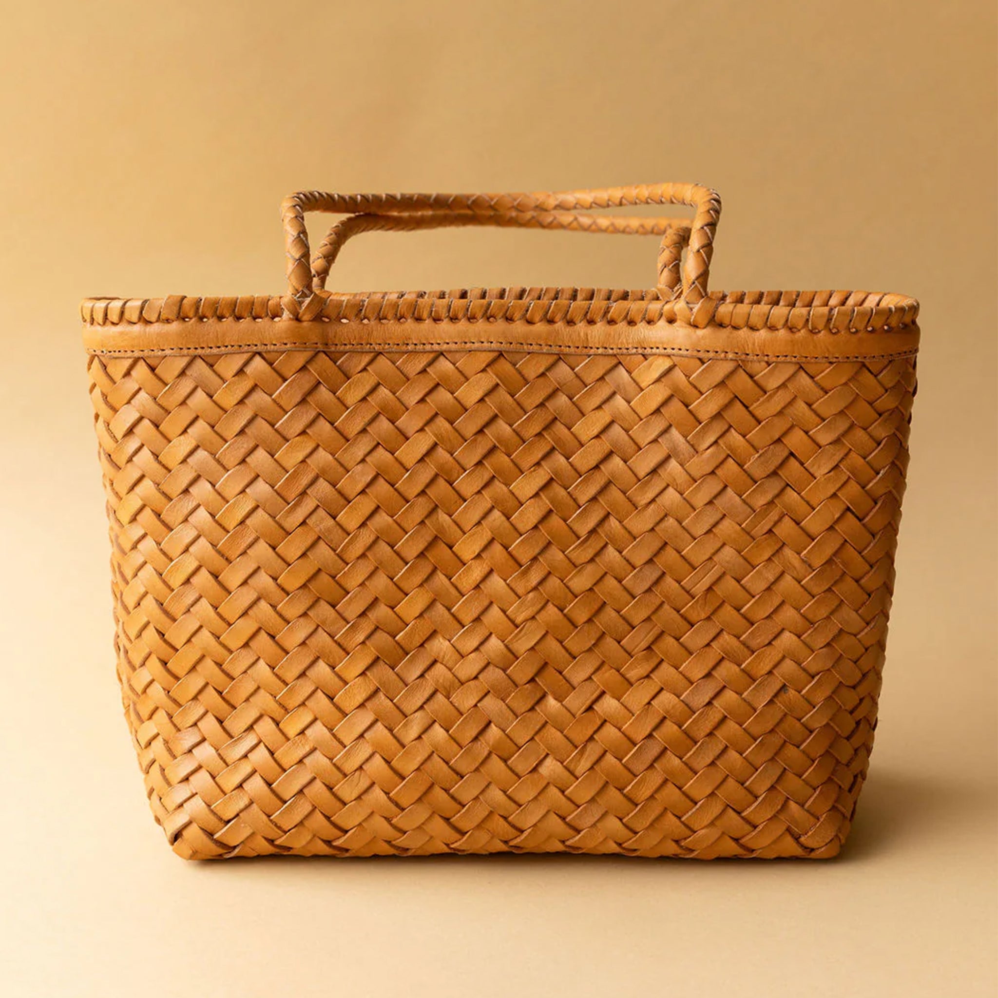 A tan woven tote bag. 