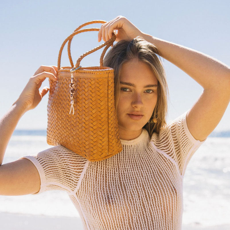 A tan woven tote bag. 