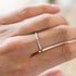A silver hammer detailed stacking ring.