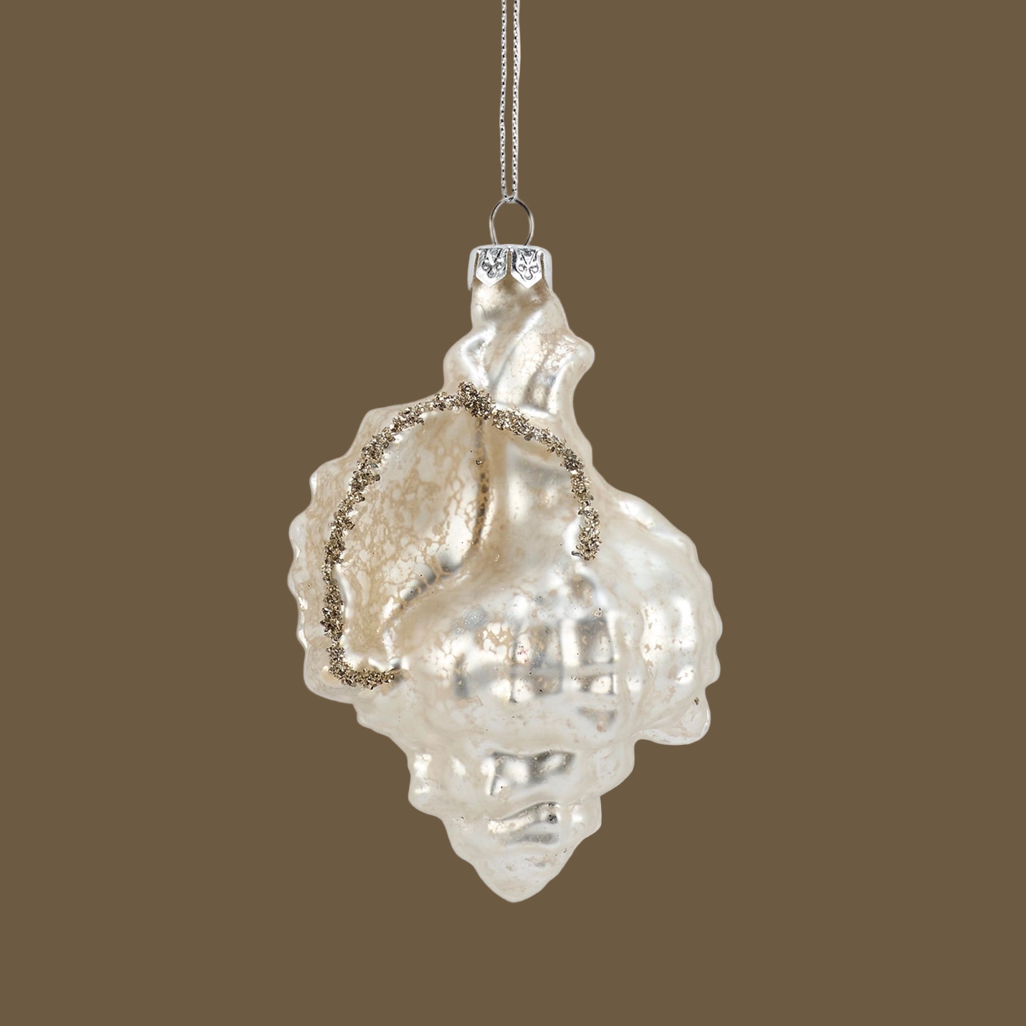 A pearly shell shaped glass ornament.