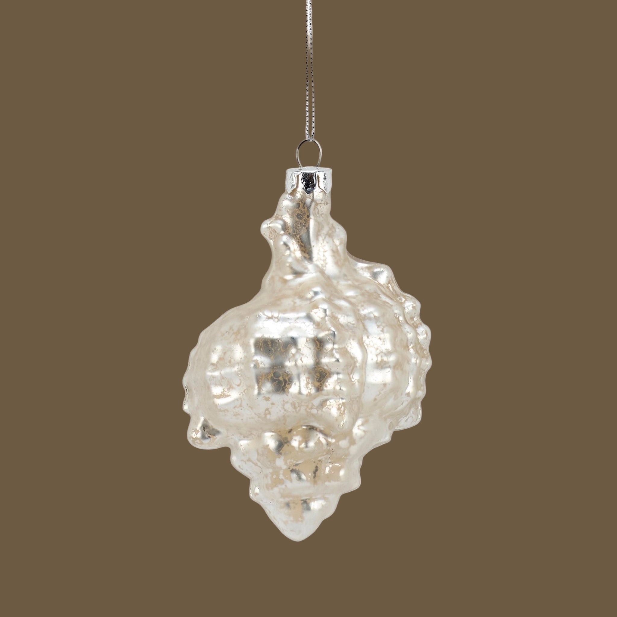 A pearly shell shaped glass ornament.