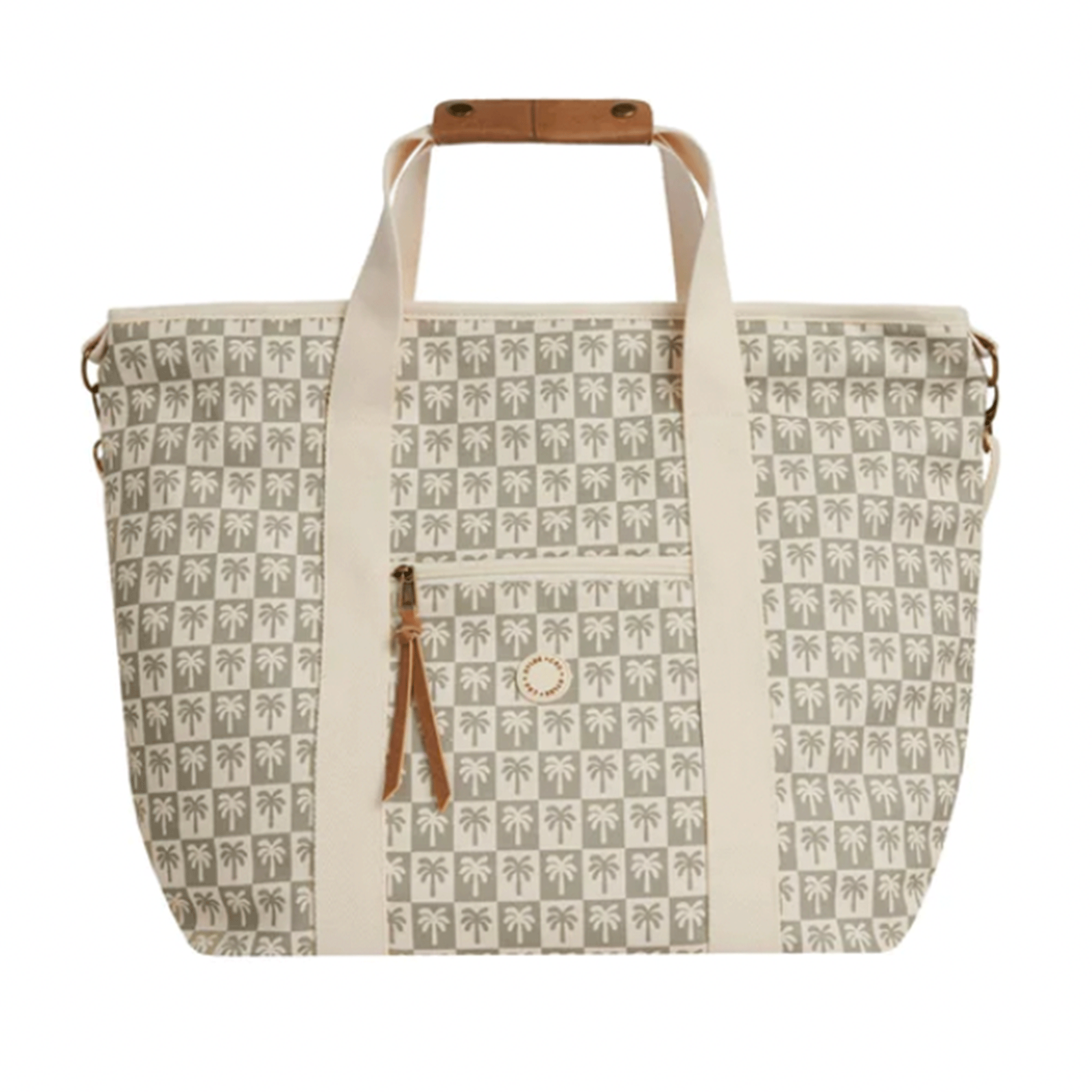 On a white background is an ivory and sage green palm tree and checker printed cooler tote bag with brown leather details and handle for holding. 