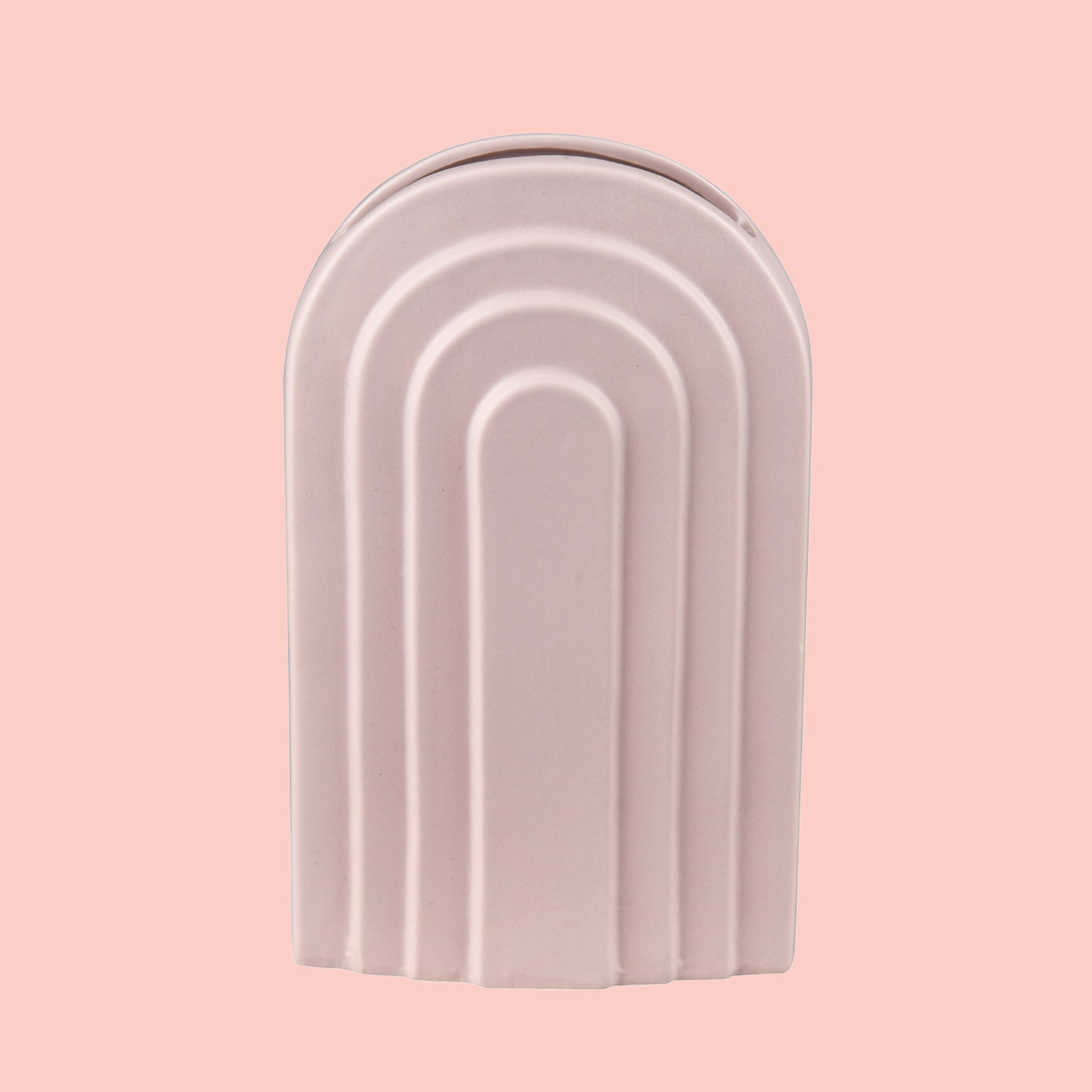 An arched ceramic vase in a cool toned pink shade. 