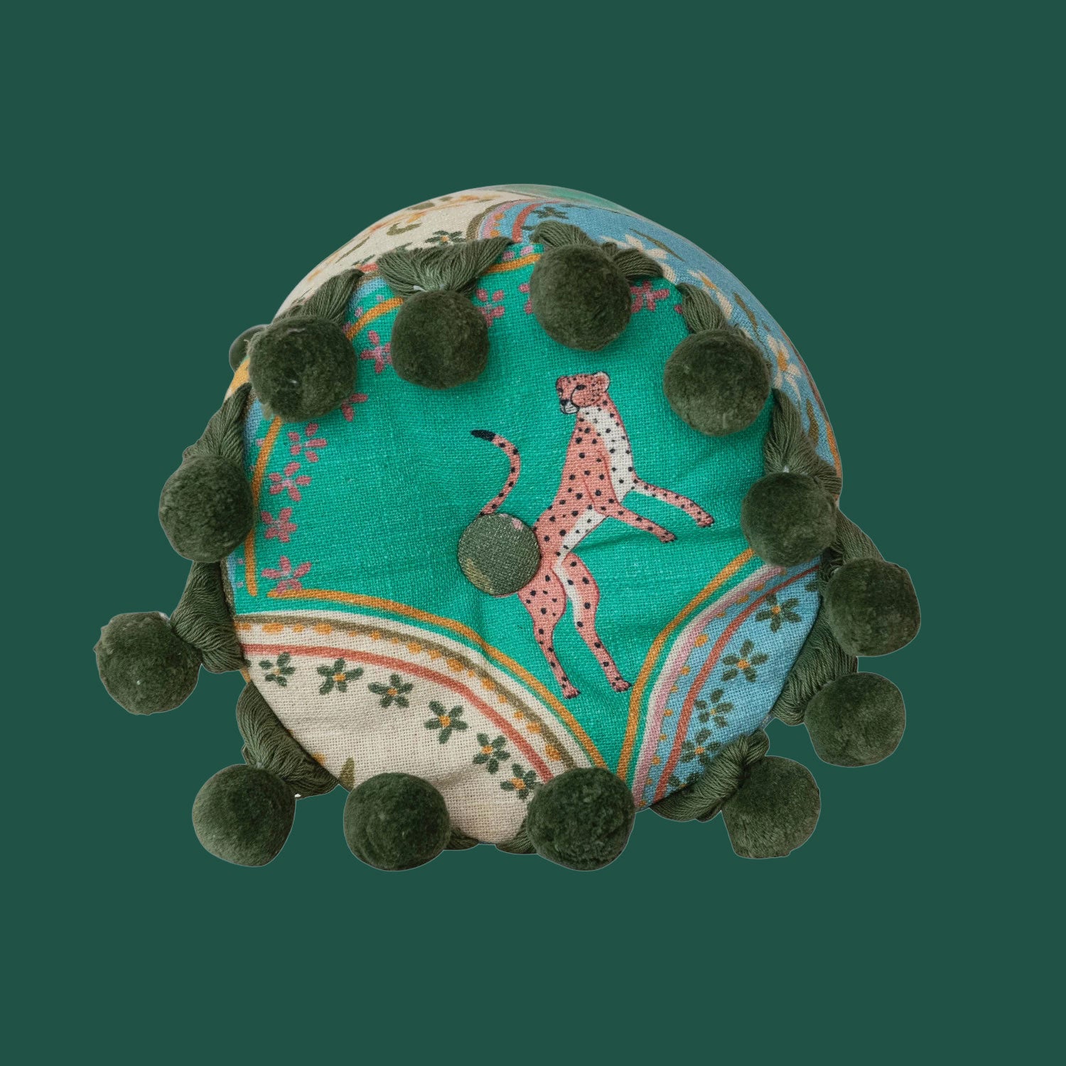 A floral and cheetah patterned bolster pillow. 