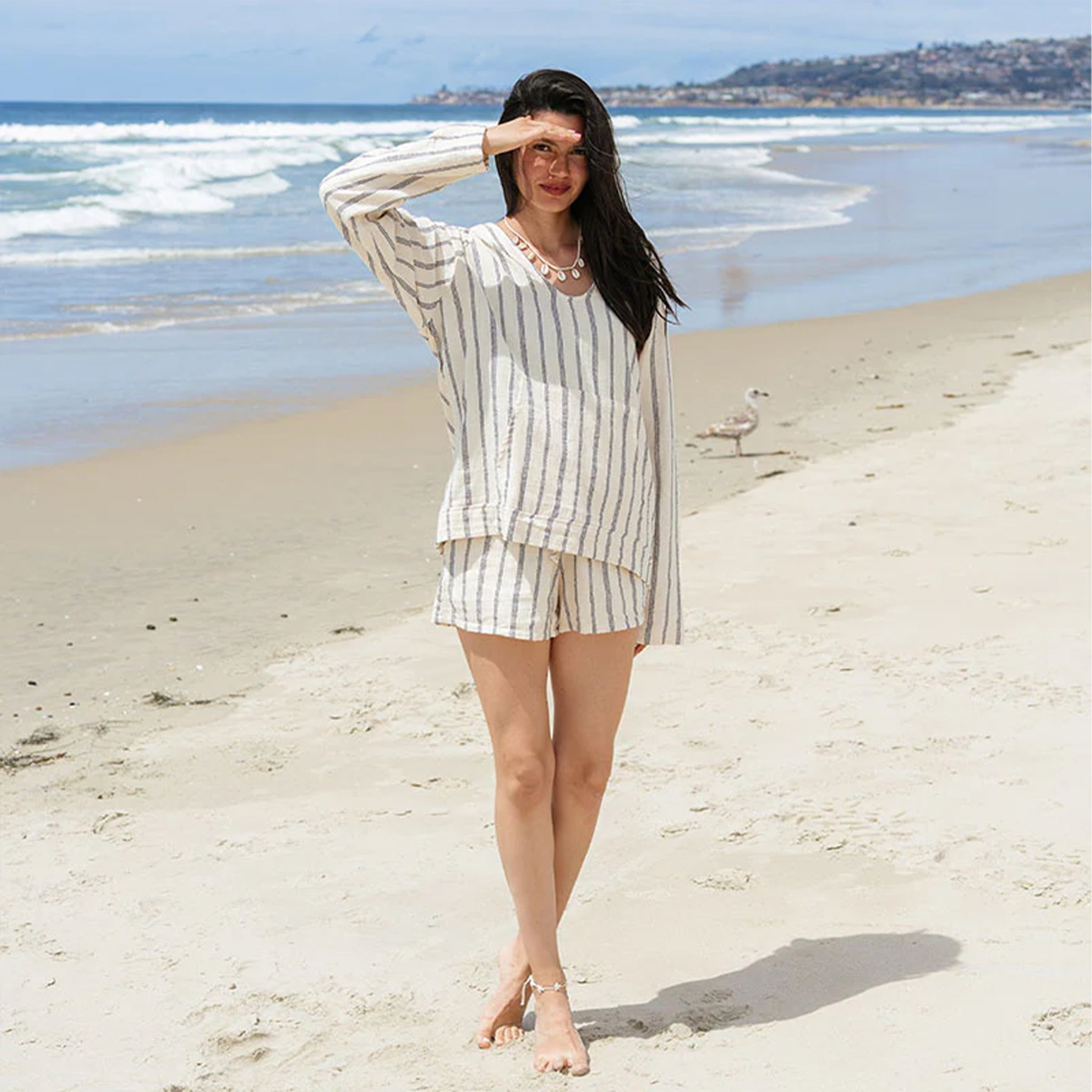 A model wearing the striped cotton shorts. 