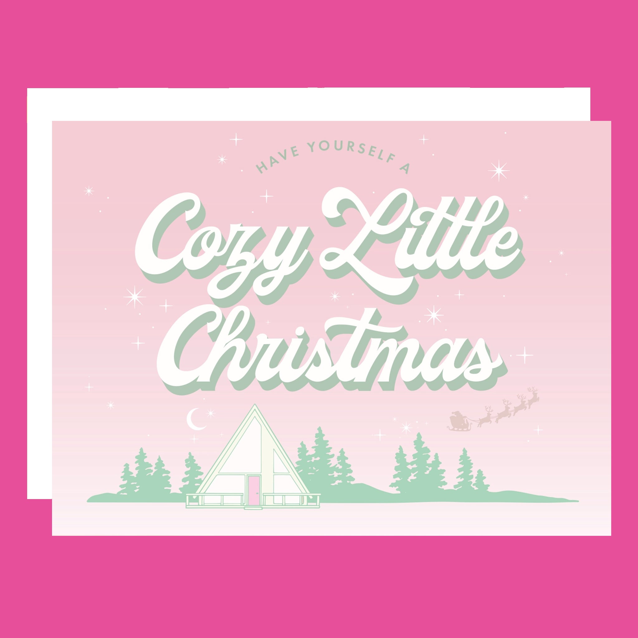 A pink and mint green Christmas card with an A-frame graphic and text above that reads, "Have Yourself A Cozy Little Christmas".