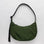 A dark green nylon crescent bag with an adjustable strap and a single zipper.