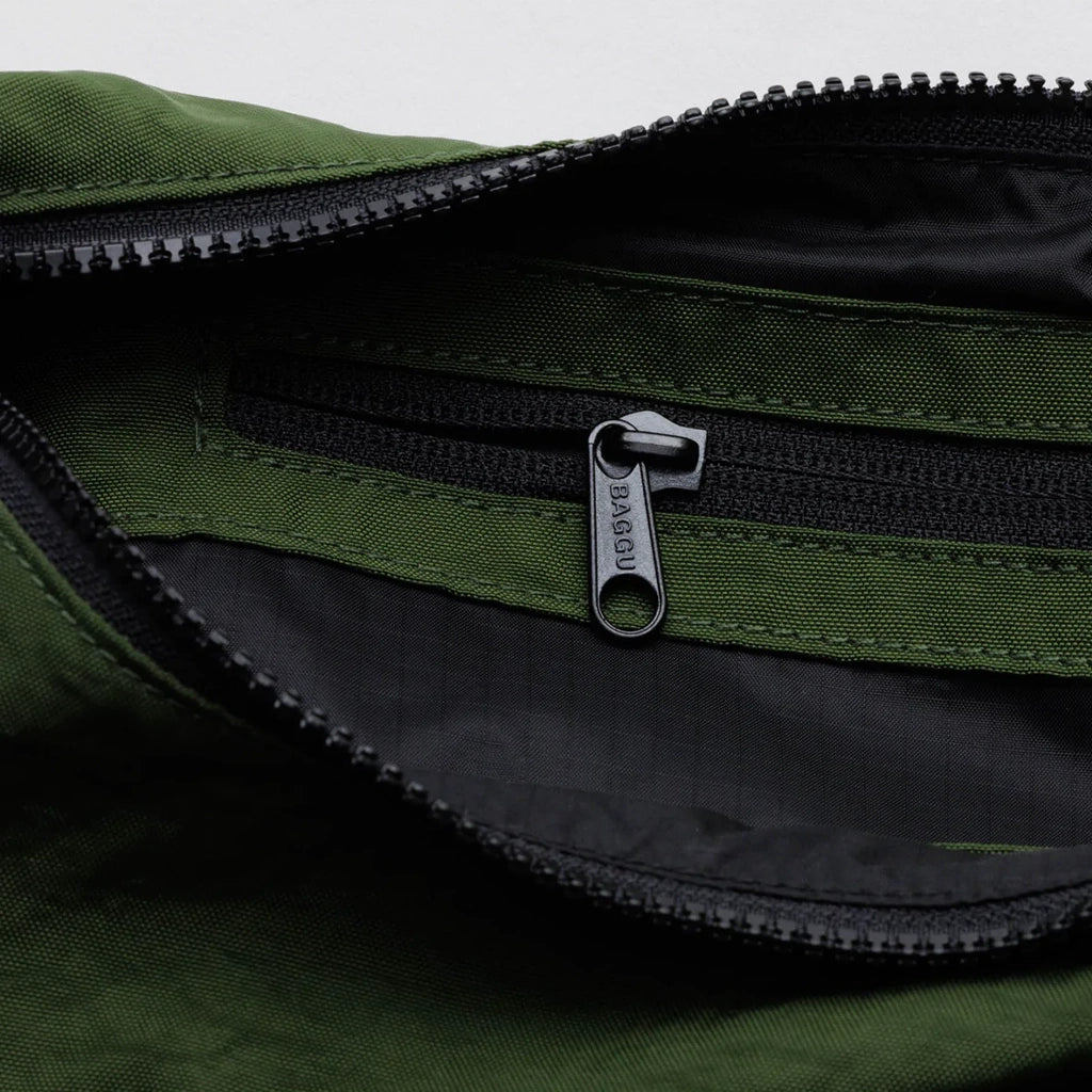 A dark green nylon crescent bag with an adjustable strap and a single zipper.