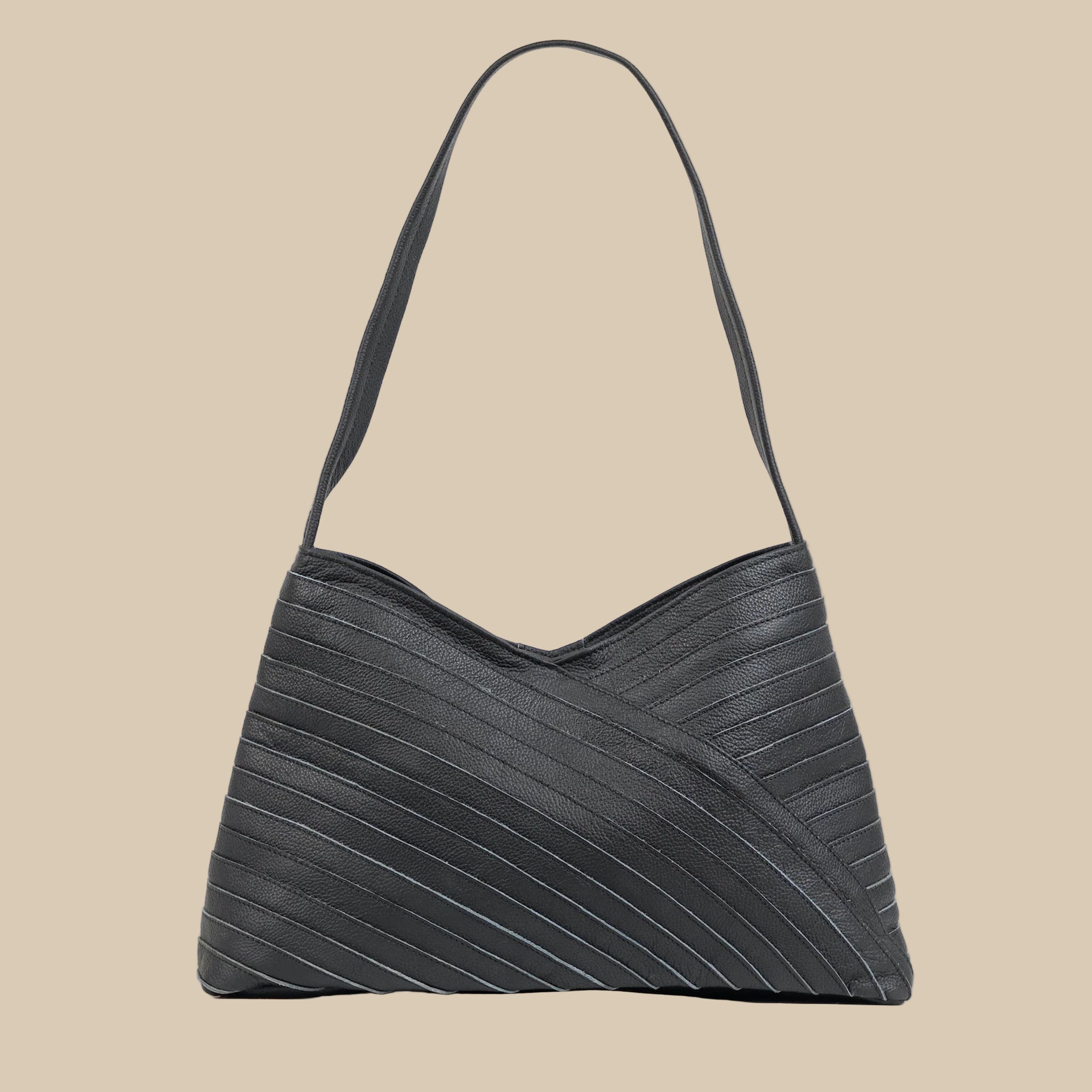 A black crisscross designed shoulder handbag. 