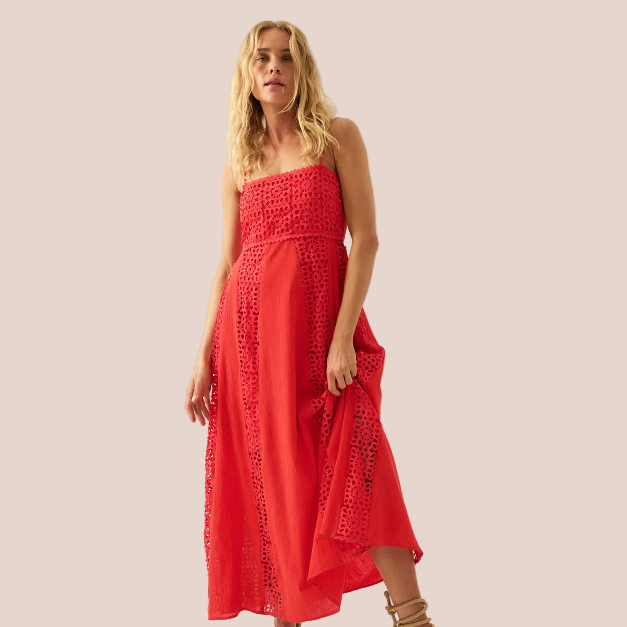 A coral red maxi dress with spaghetti straps. 