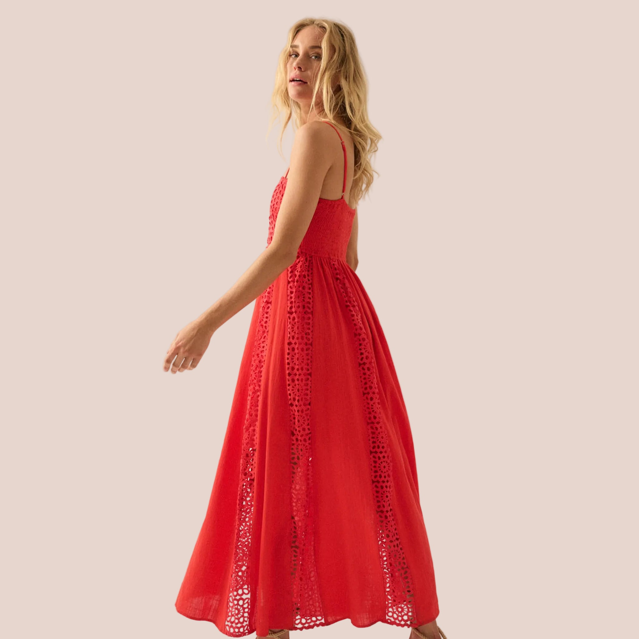 A coral red maxi dress with spaghetti straps. 