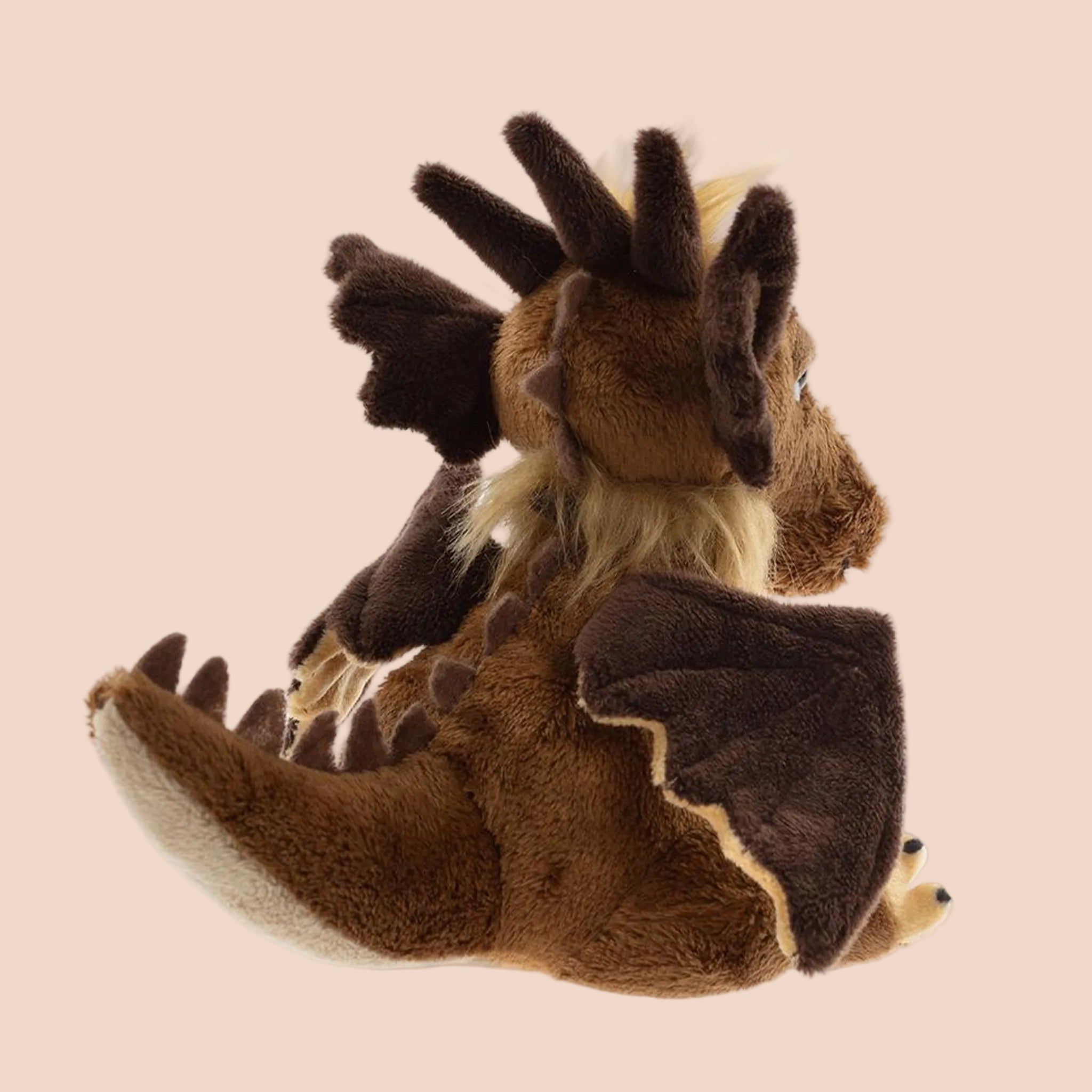 A mythical creature shaped stuffed animal toy. 