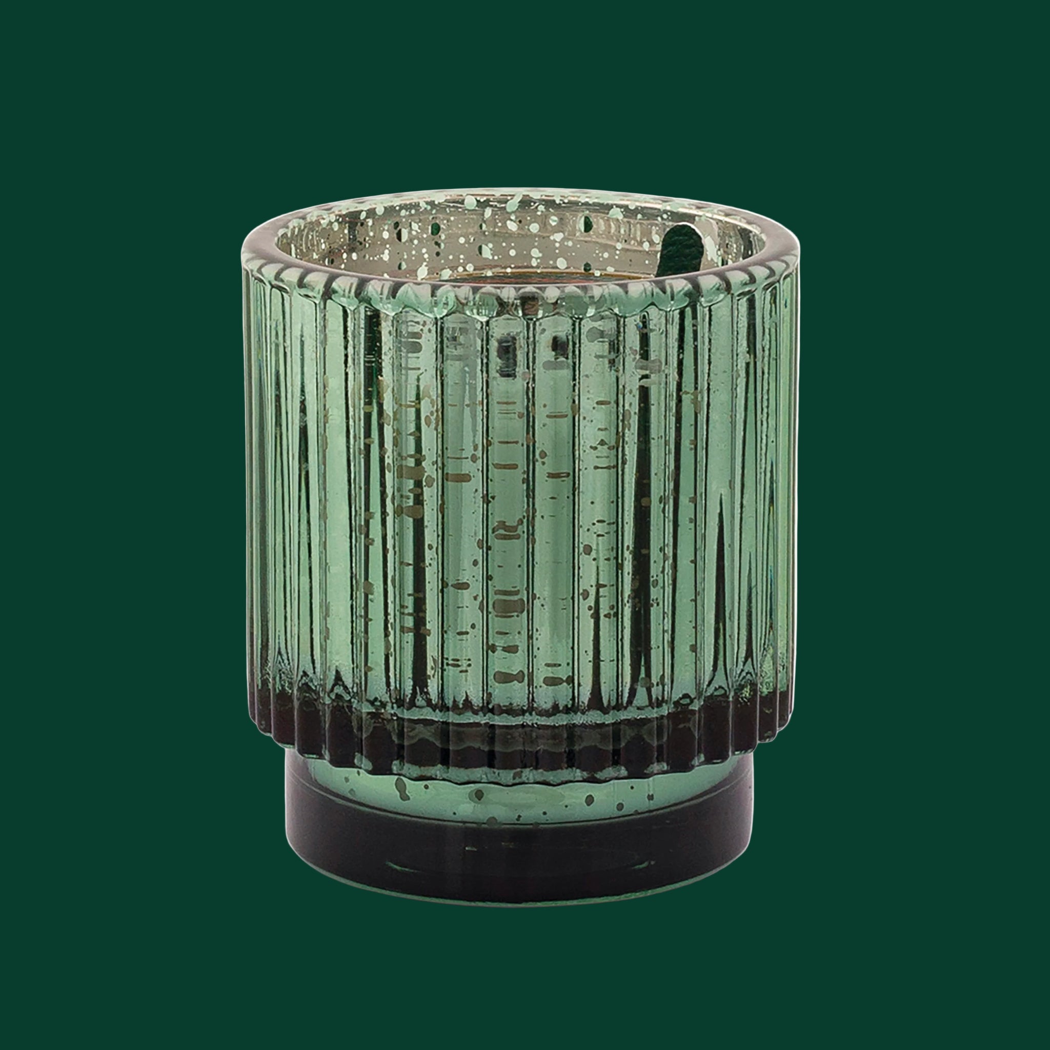 A green ribbed glass candle. 
