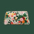 A quilted cosmetic case with a multi colored floral pattern. 