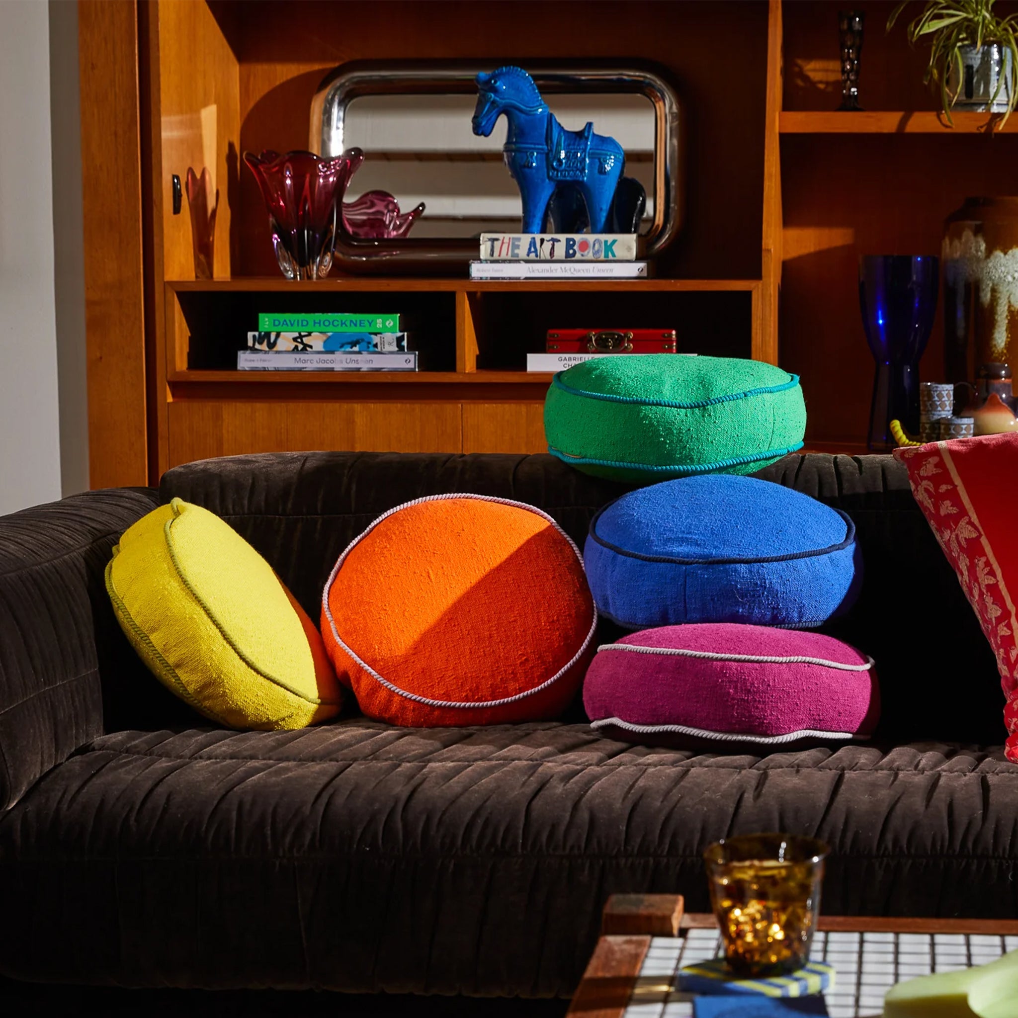 A round orange pillow cushion. 