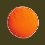 A round orange pillow cushion. 