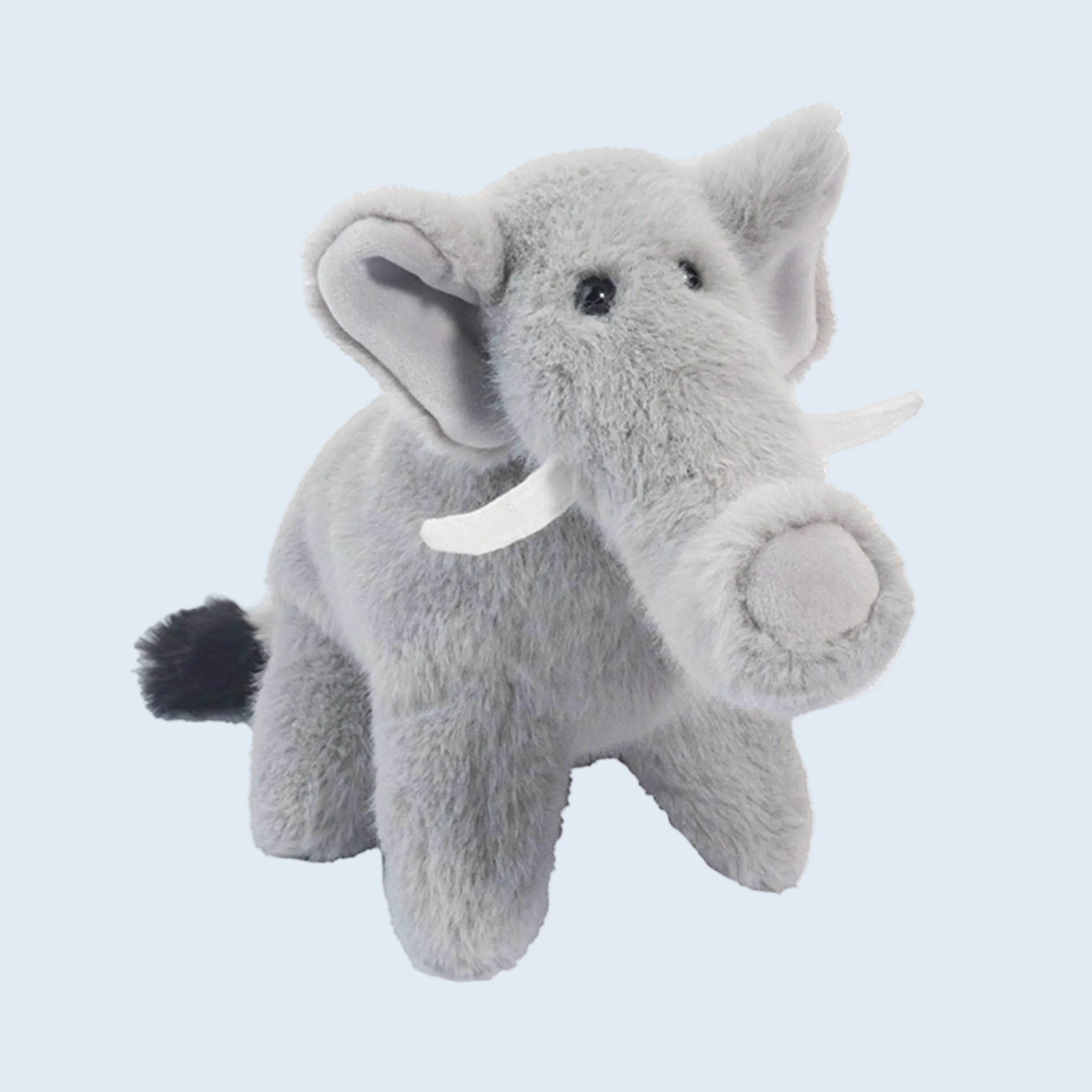 A gray elephant shaped stuffed animal. 