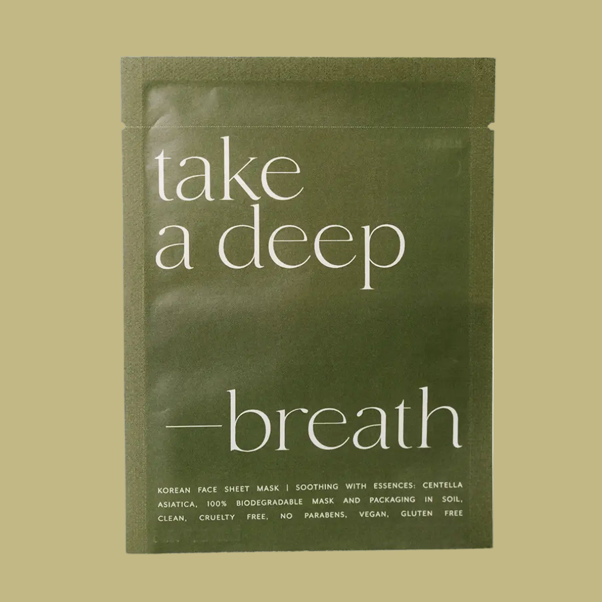 A green sheet mask packaging with text that reads, "take a deep - breath Korean Face Sheet Mask". 
