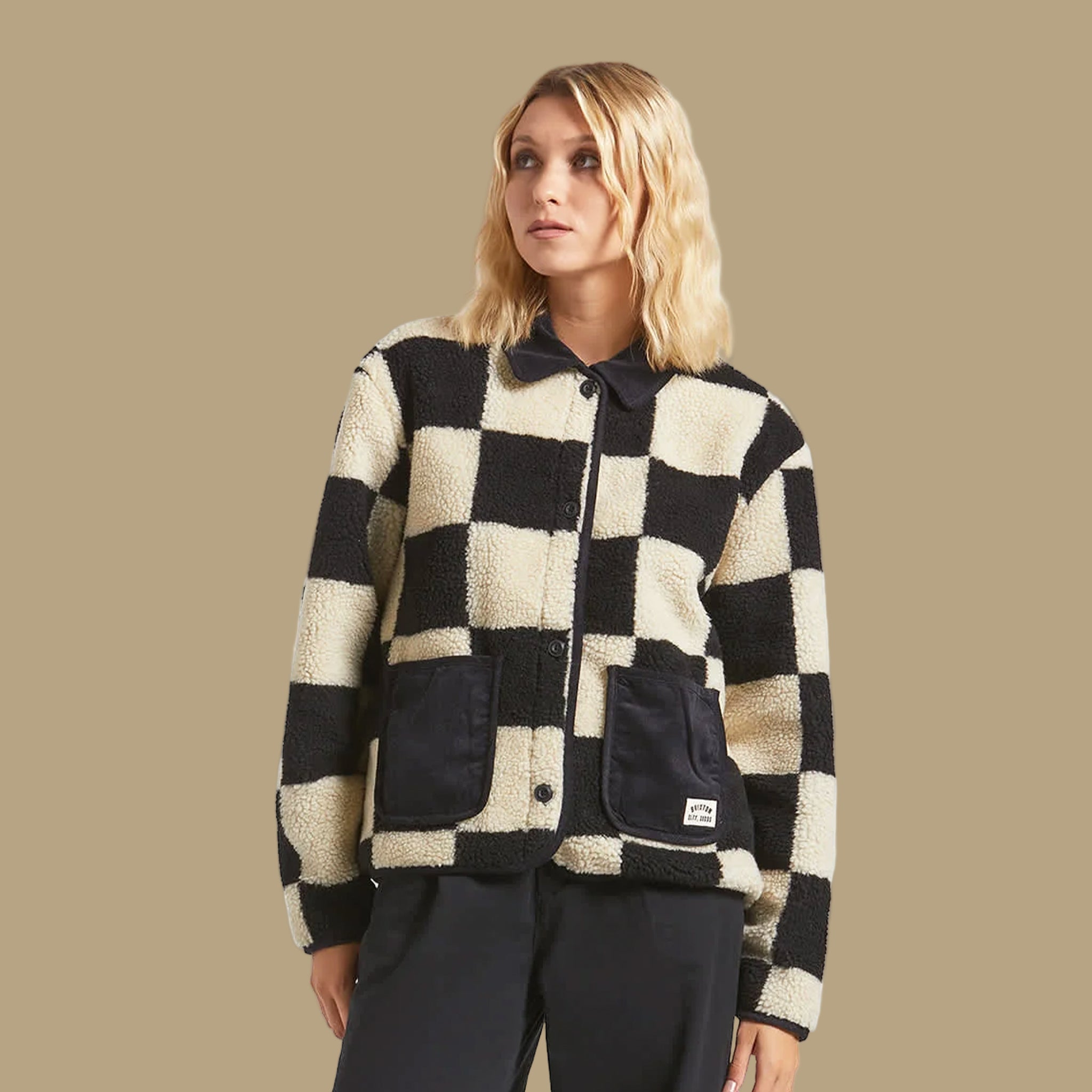 A black and cream checkered sherpa jacket. 
