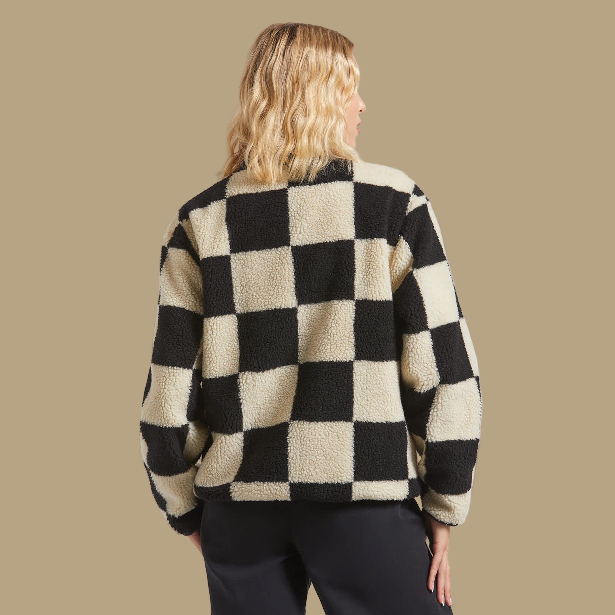 A black and cream checkered sherpa jacket. 