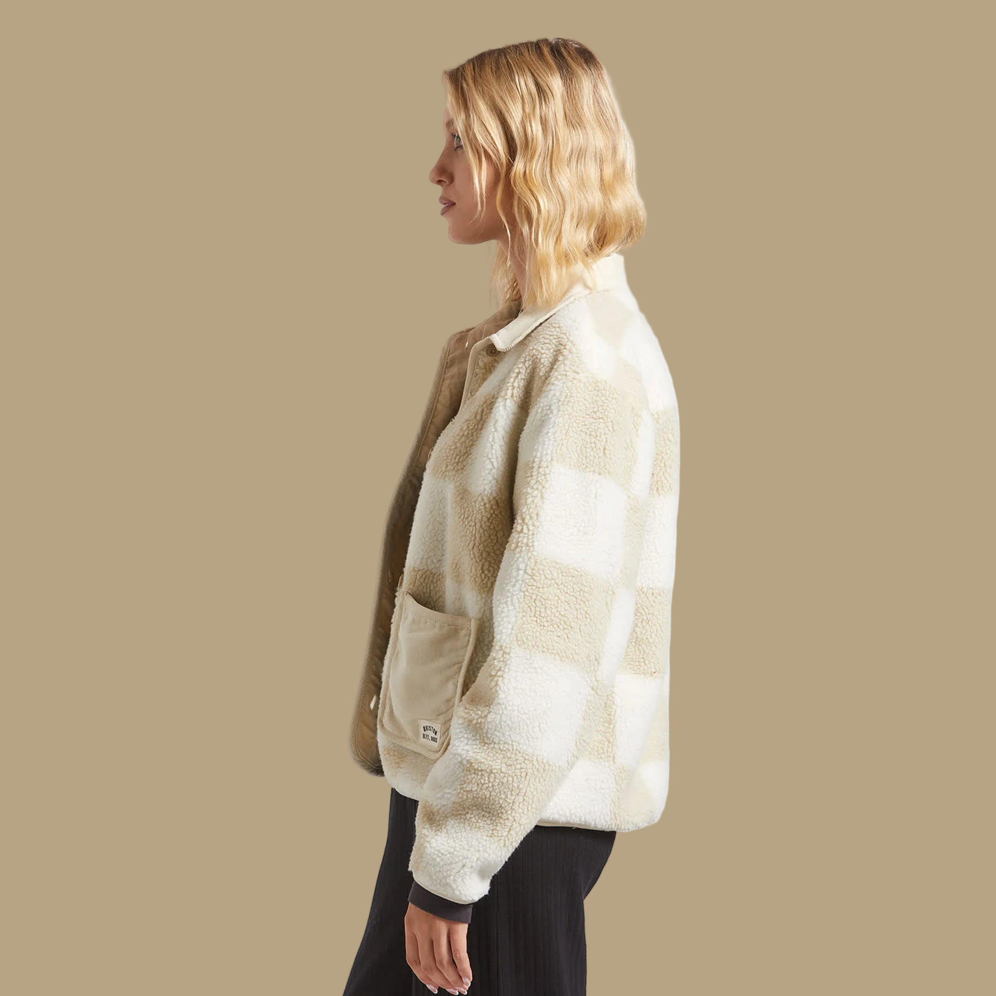 A tan and white checkered sherpa jacket. 