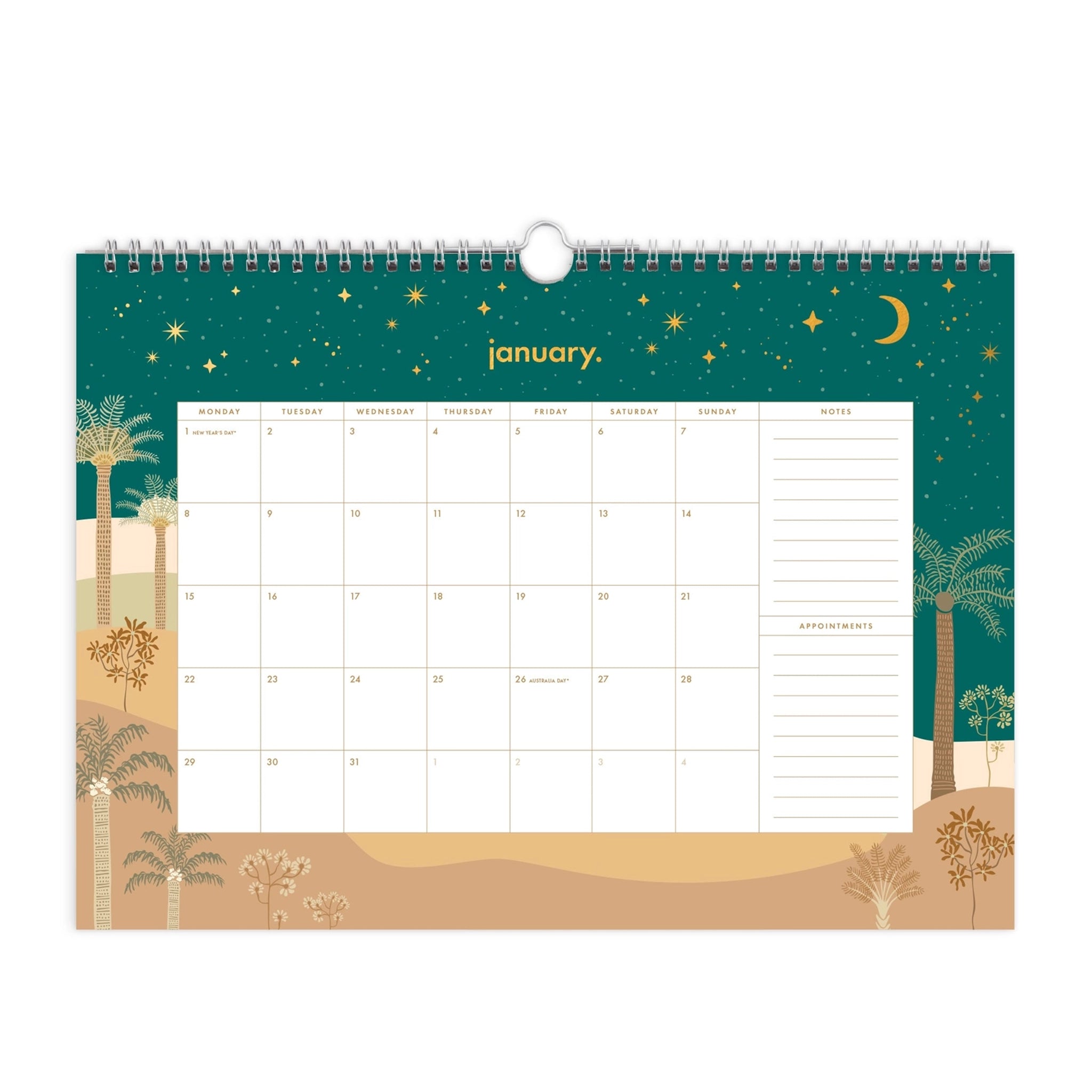 On a white background is a spiral bound calendar with an illustration of a desert scape at night time along with a white monthly view in the center. 