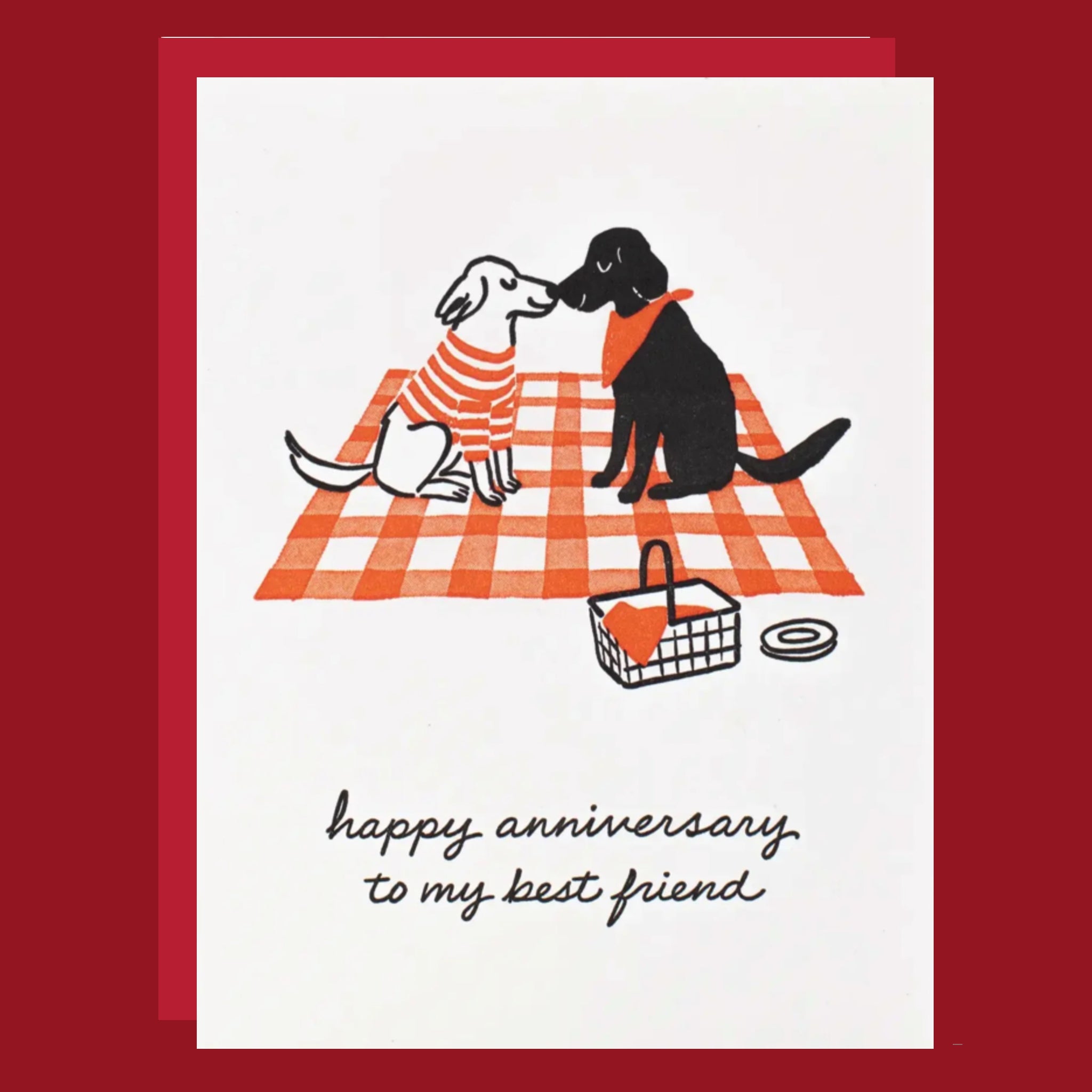 Card with illustration of two dogs on a picnic blanket and 'happy anniversary to my best friend' text.