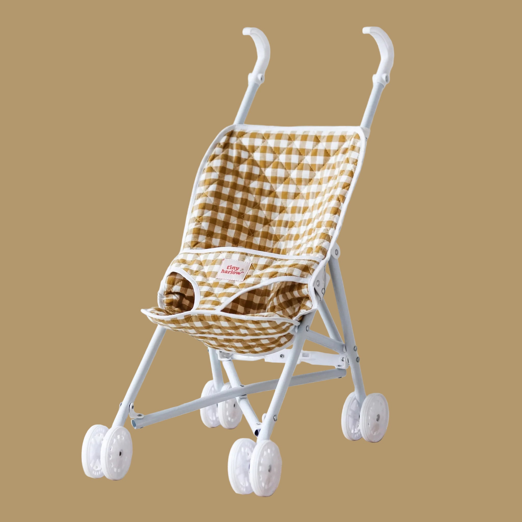 A mustard gingham print toy doll stoller. 