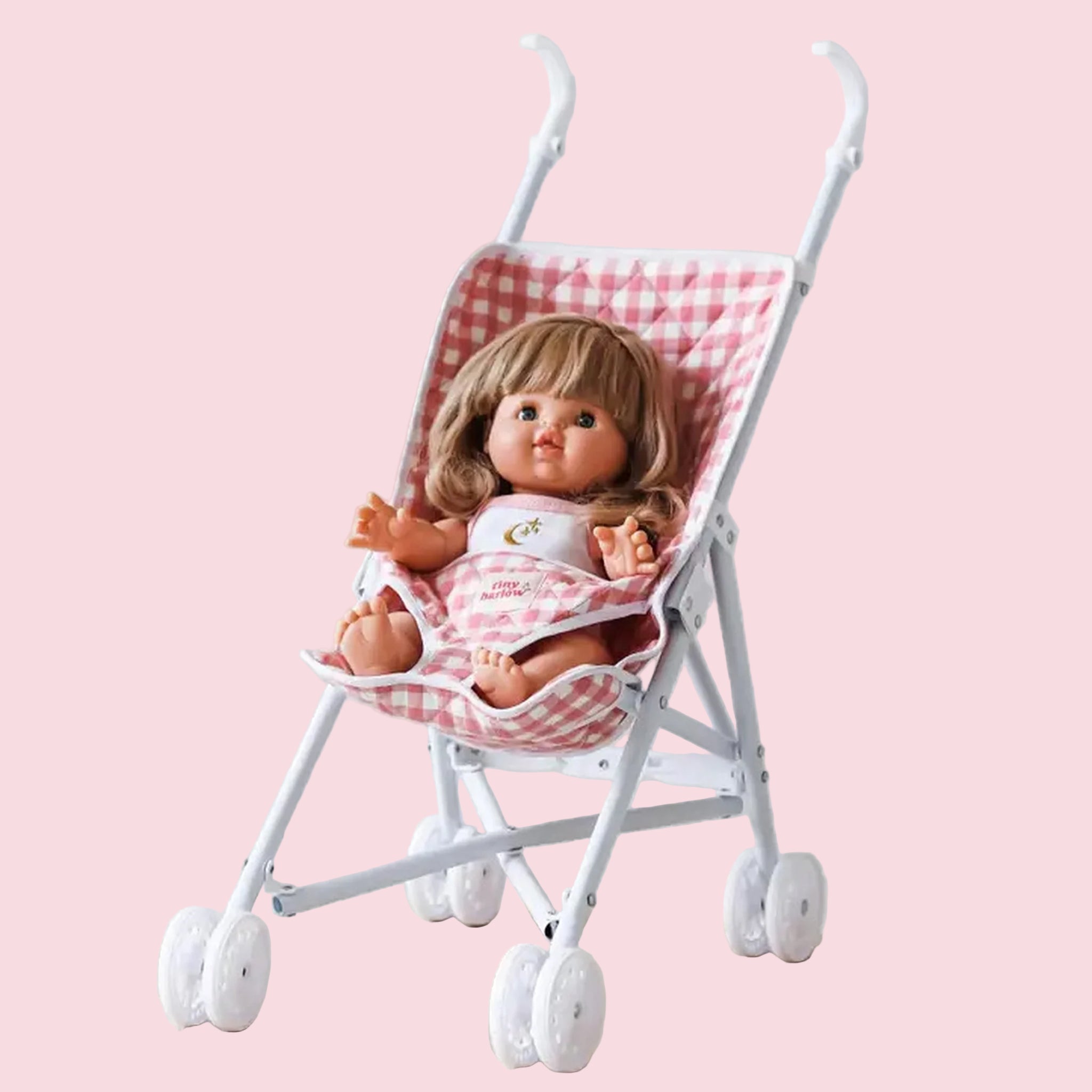 A pink and cream gingham print doll troller. 