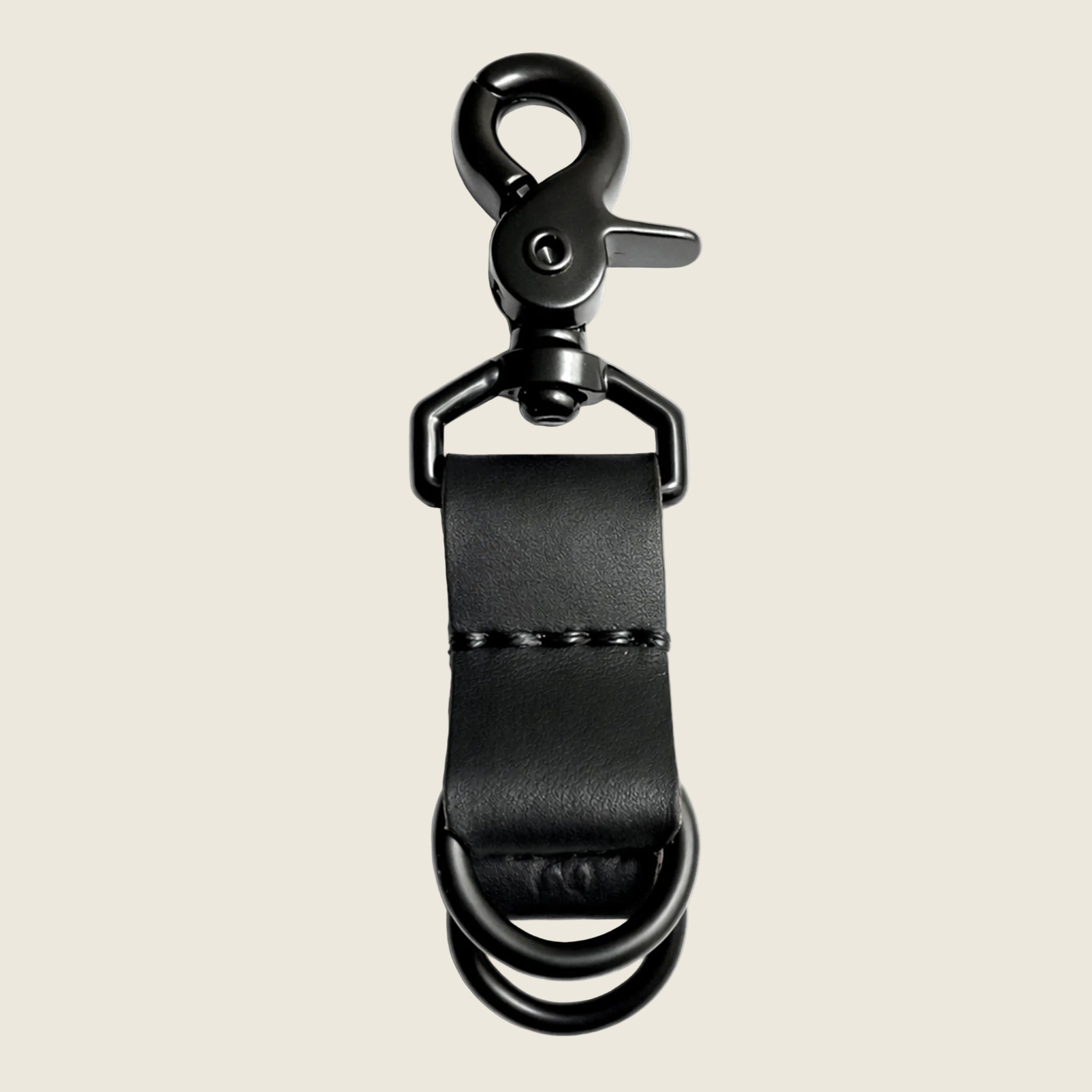 A black leather keychain with a double loop. 