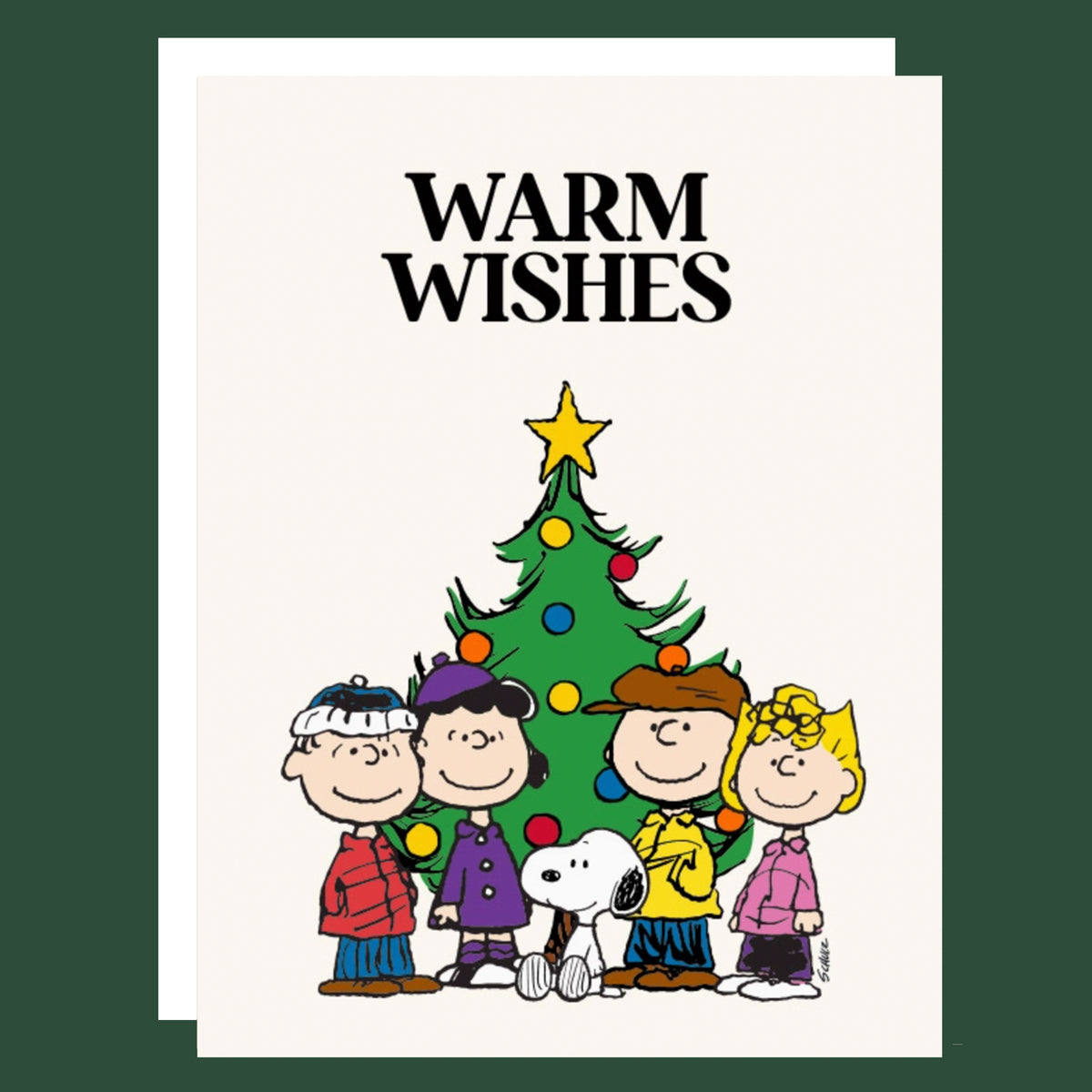 A square greeting card with a white background featuring the text 'WARM WISHES' above a cartoon Christmas tree and Peanuts characters, shown against a dark green background.