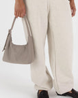 A mini beige / grey nylon shoulder handbag with an adjustable strap.