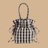 A black and cream drawstring bag.