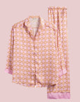 a lilac and orange floral print satin pajama set with long pants and long sleeves. 
