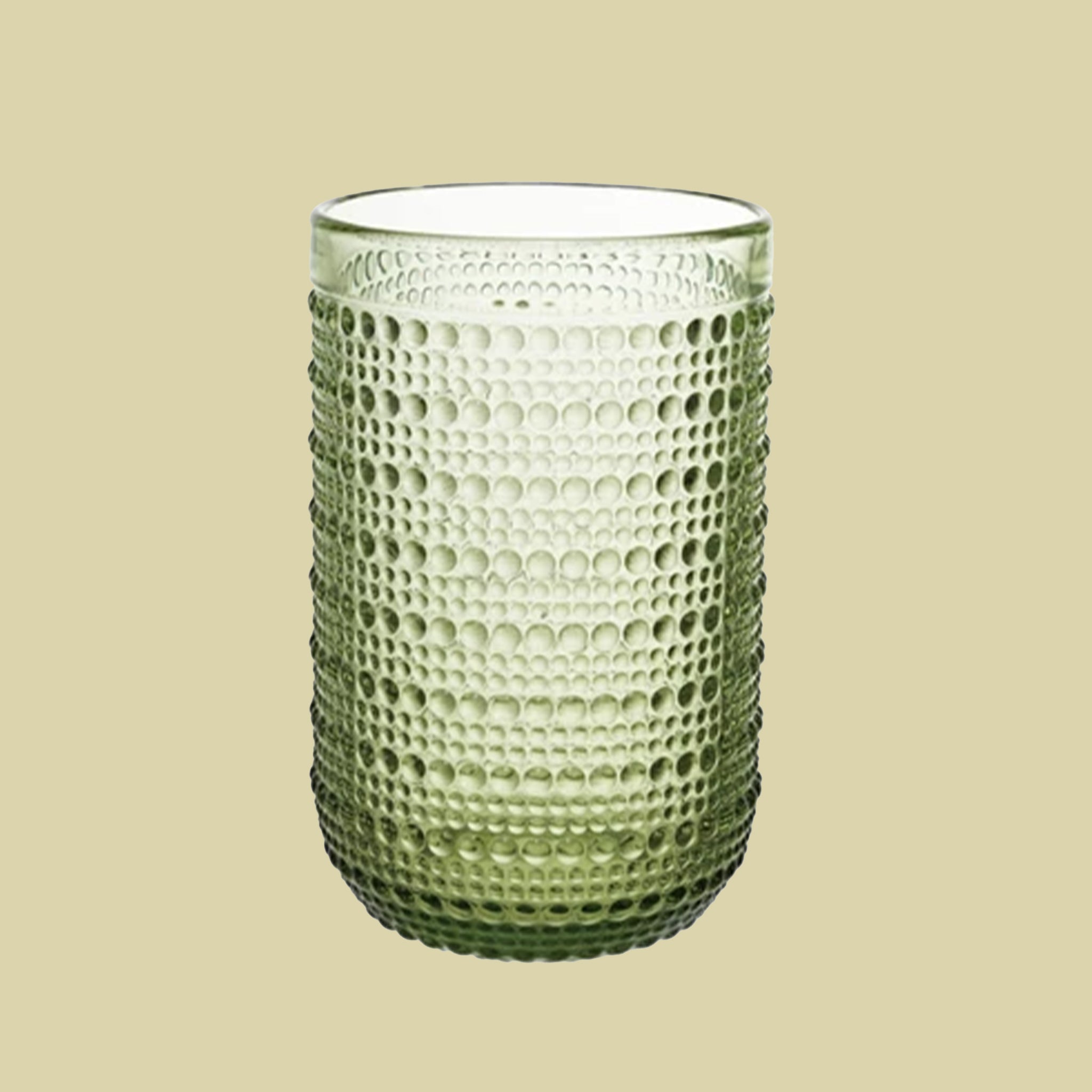 A green raised dot drinking glass available in two sizes. Each sold separately. 