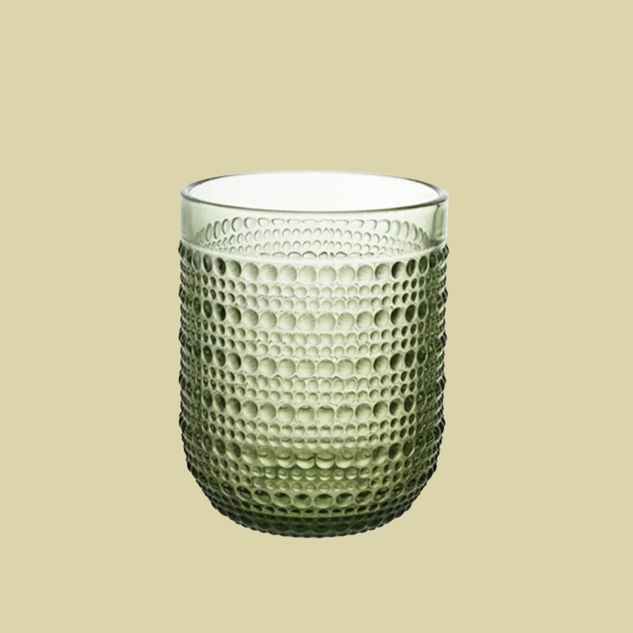 A green raised dot drinking glass available in two sizes. Each sold separately. 